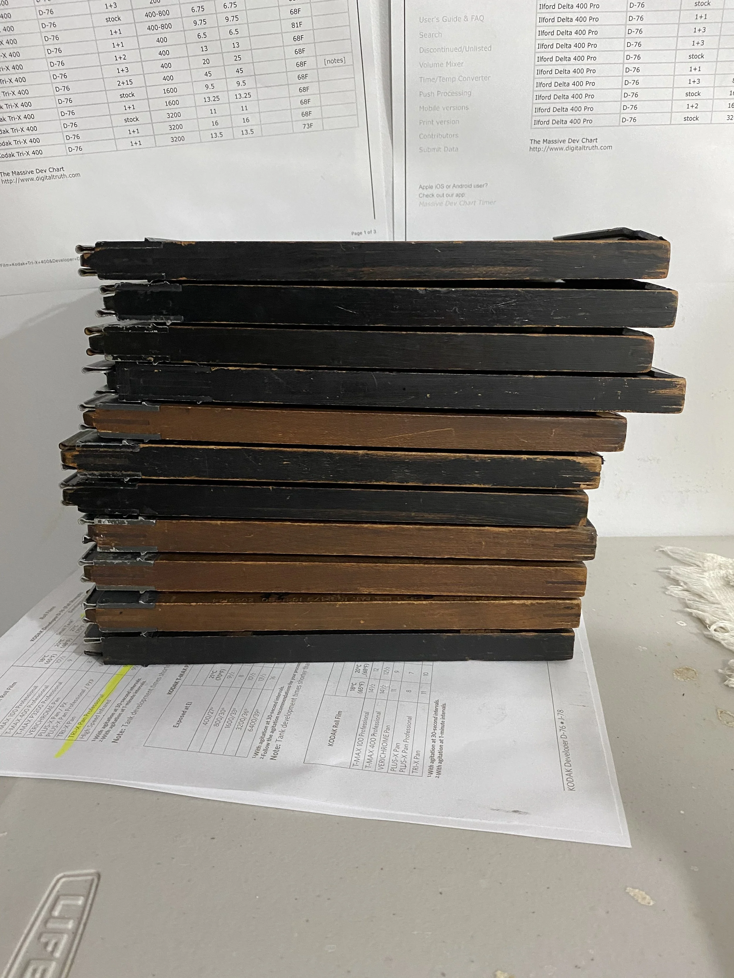 Stack of film holders, alternating in color between black and brown.