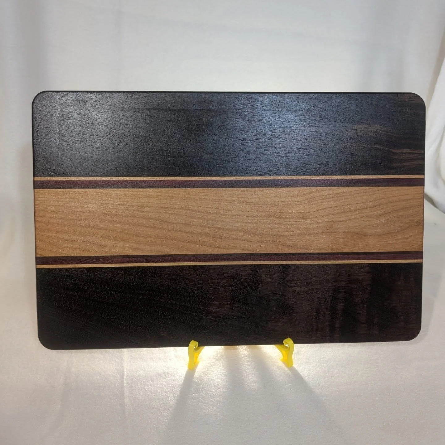 Cutting board made with #hickory #purpleheart #walnutwood and #cherrywood