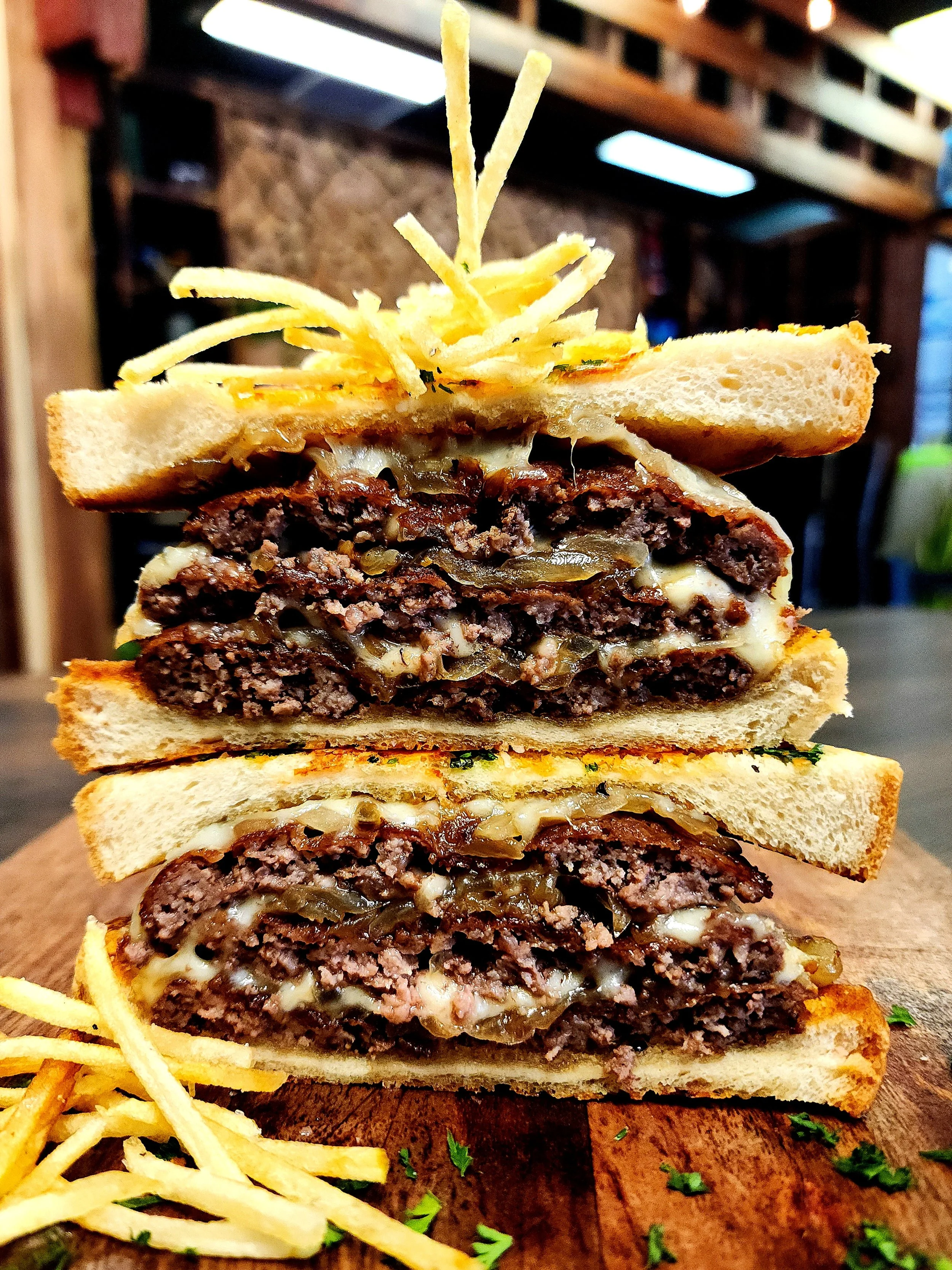 "Triple Stack Patty Melt" - Smoked Provolone, Sauteed Onion, & Tater Sticks