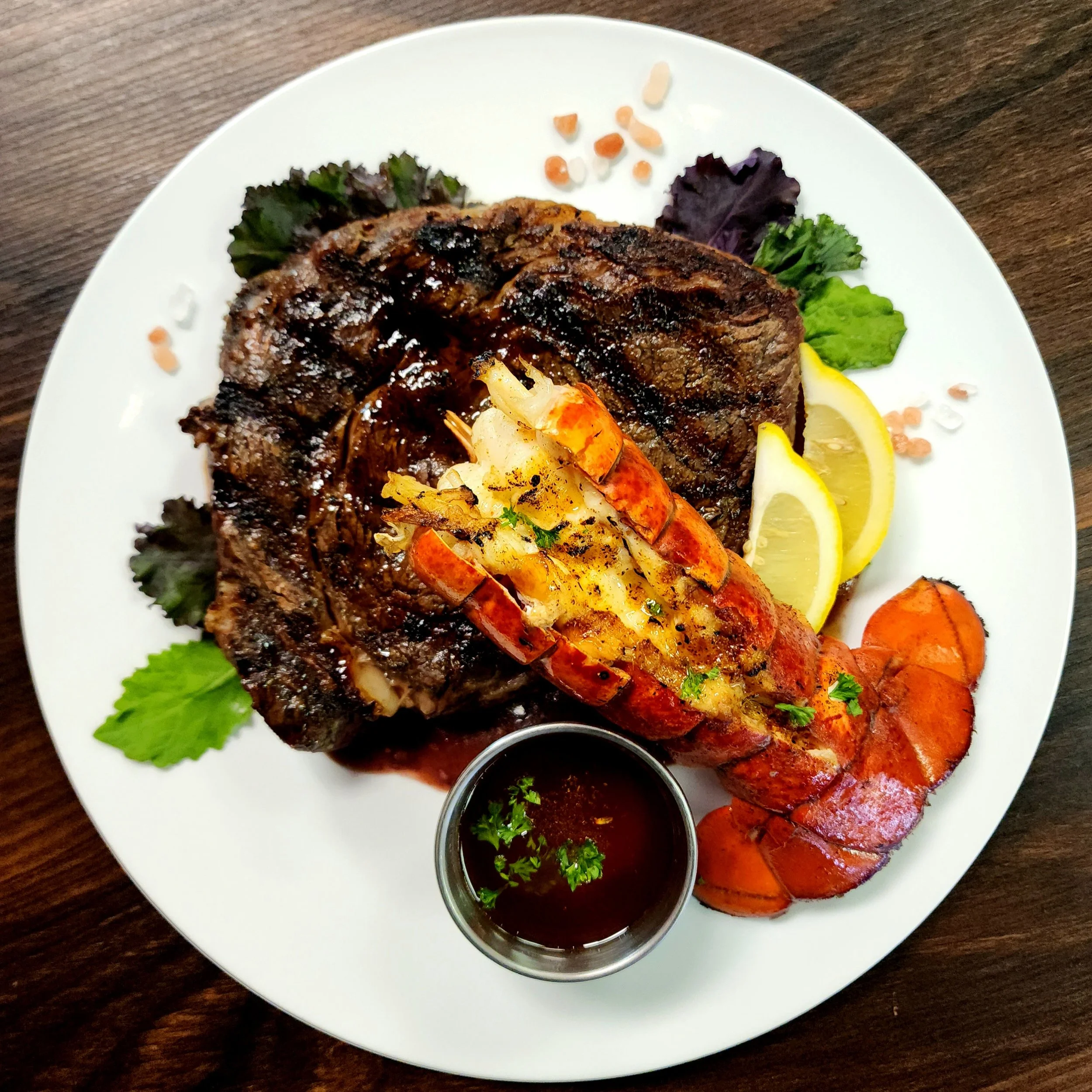 14oz Gunpowder Ribeye with a 6oz Flame Broiled Cold Water Lobster Tail. 