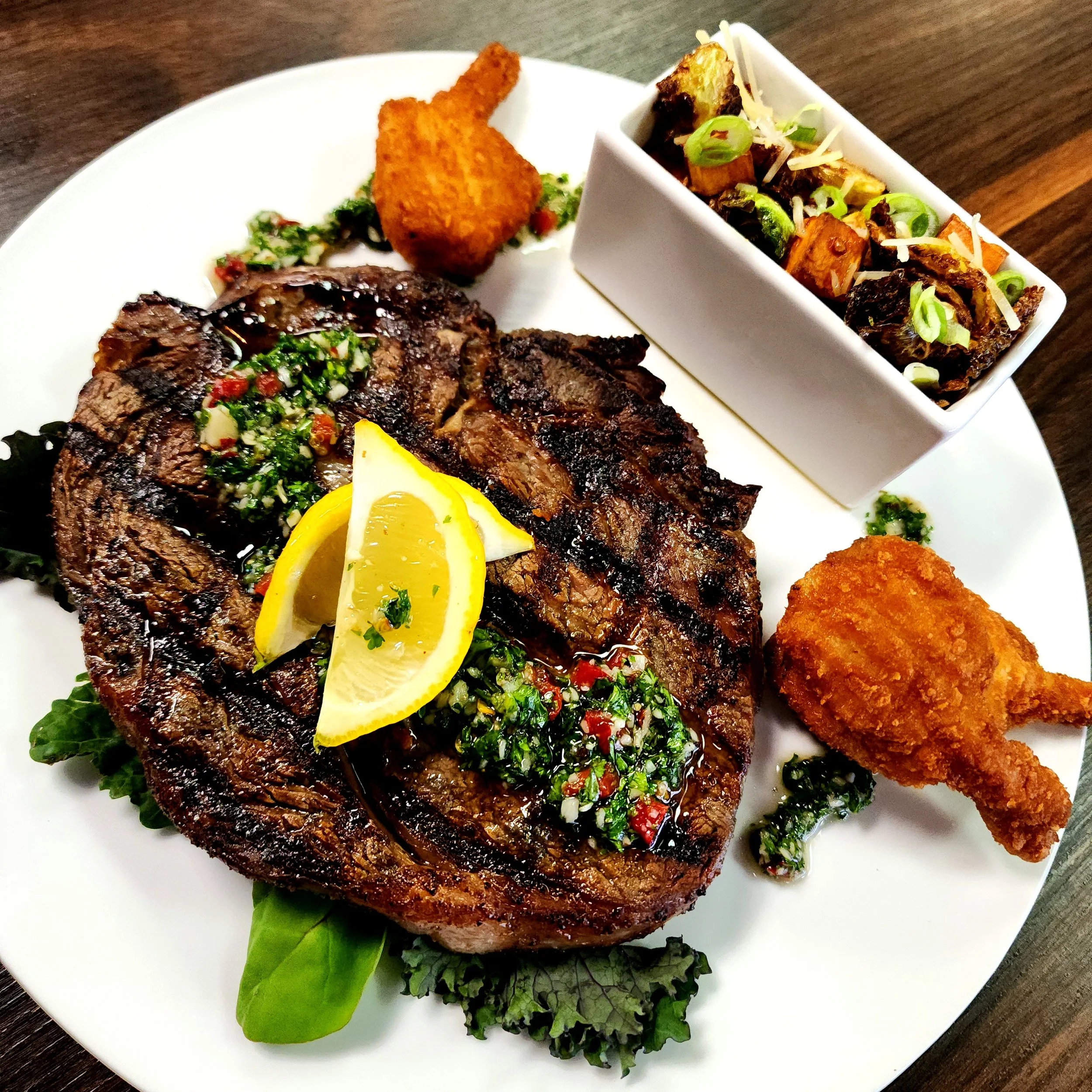 14oz Gunpowder Ribeye topped with Chimichurri & Cheddar Stuffed Shrimp. 