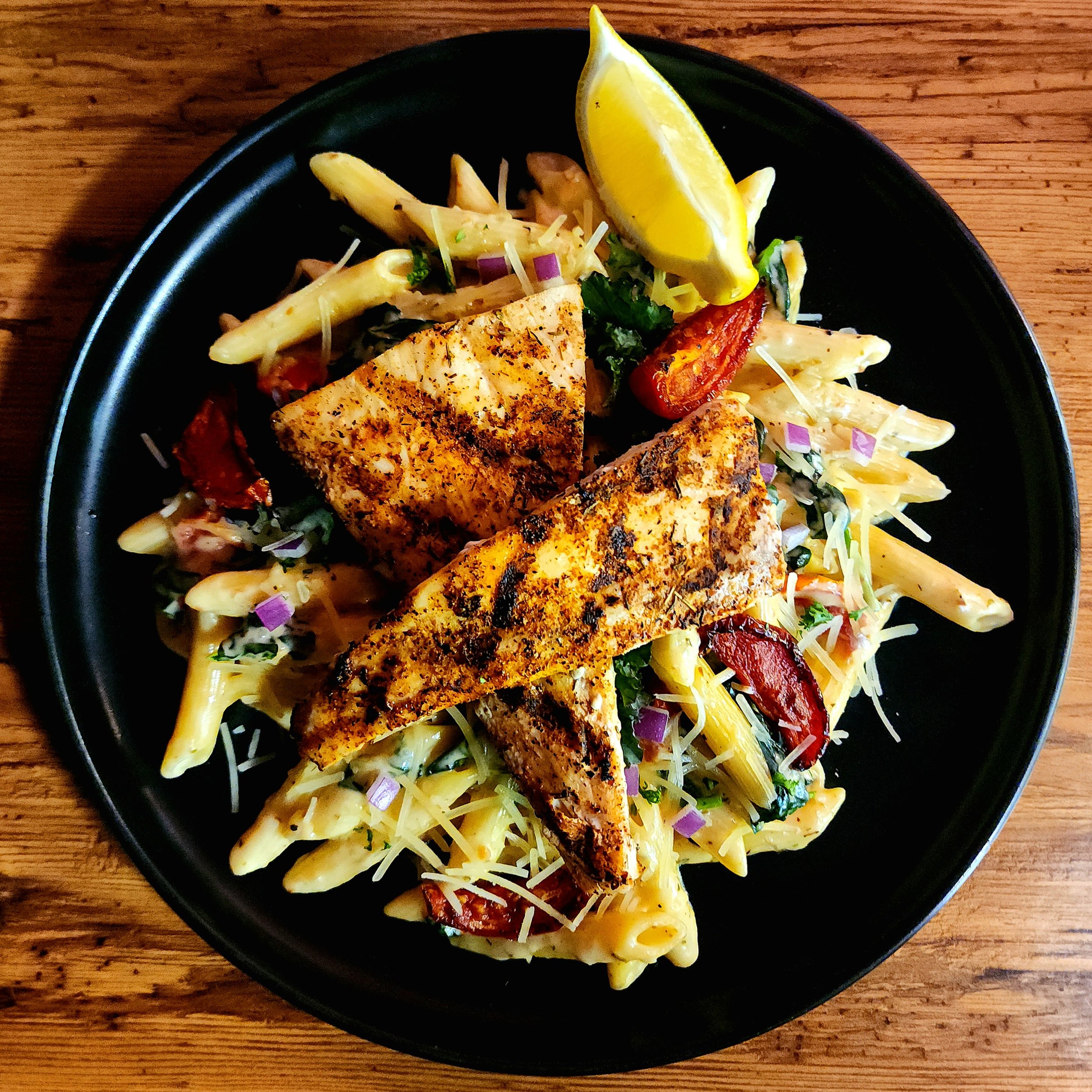 Loaded Tuscan Pasta with Red Snapper. 