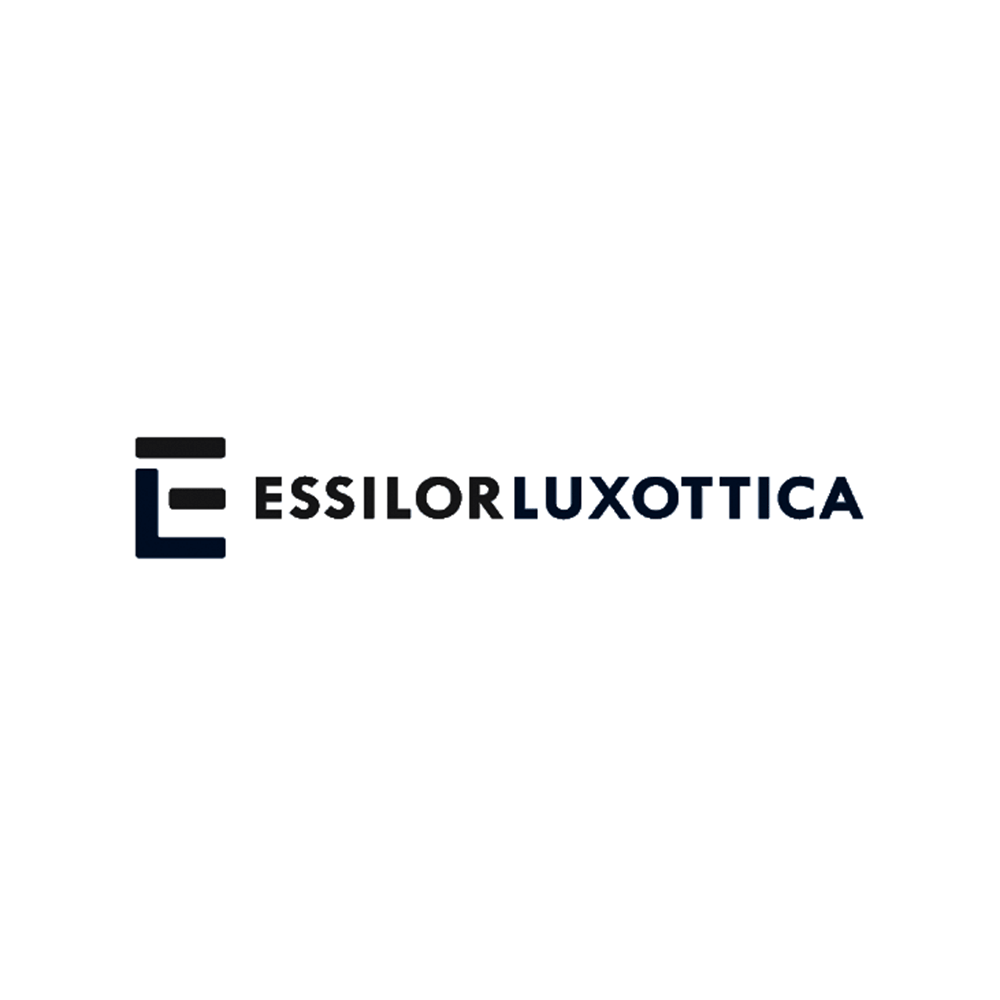 The logo for ESSILOR LUXOTTICA features the company's name in black and dark blue text, accompanied by a stylized geometric emblem on the left side.