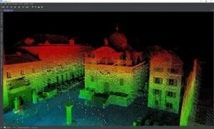 A 3D laser scan of a historic city square during night, with colorful point cloud data highlighting buildings and architectural details.
