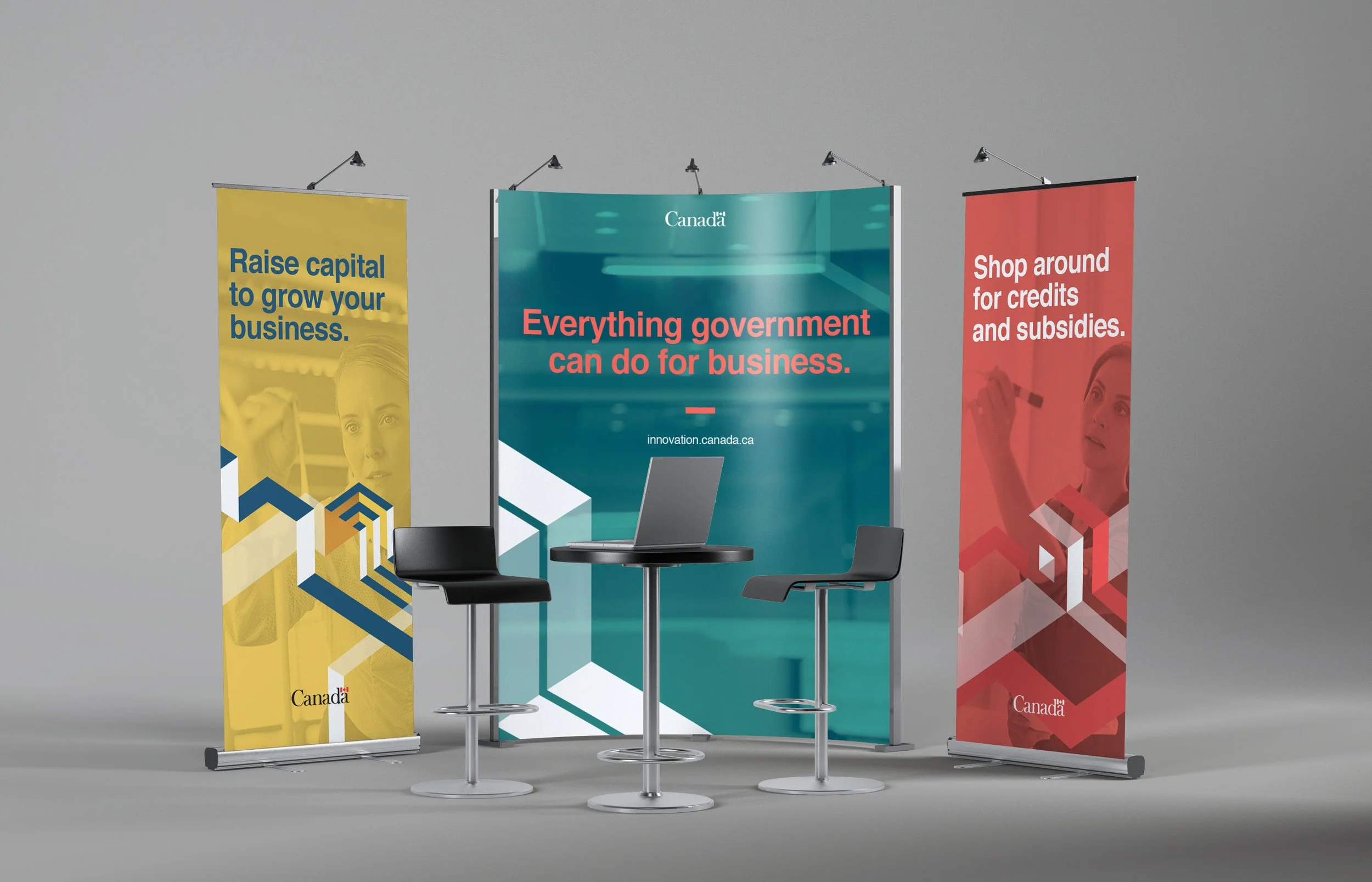 Trade show booth with banners promoting Canadian government services for business, including slogans like 'Raise capital to grow your business,' 'Everything government can do for business,' and 'Shop around for credits and subsidies,' with a table an
