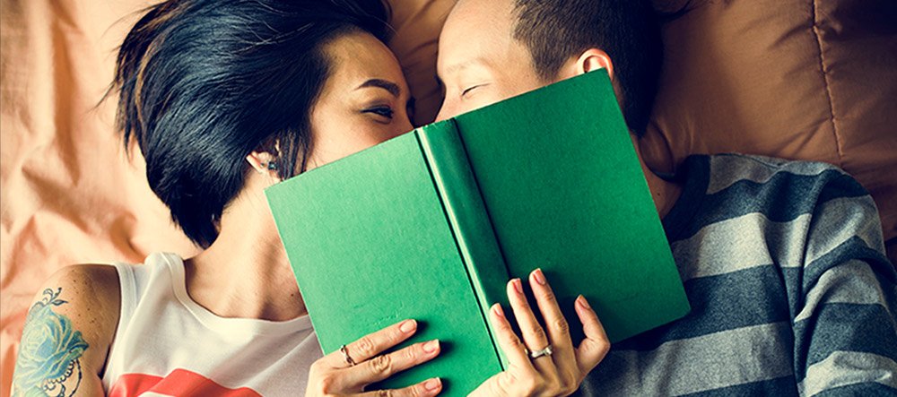 Couple laying down and smiling
