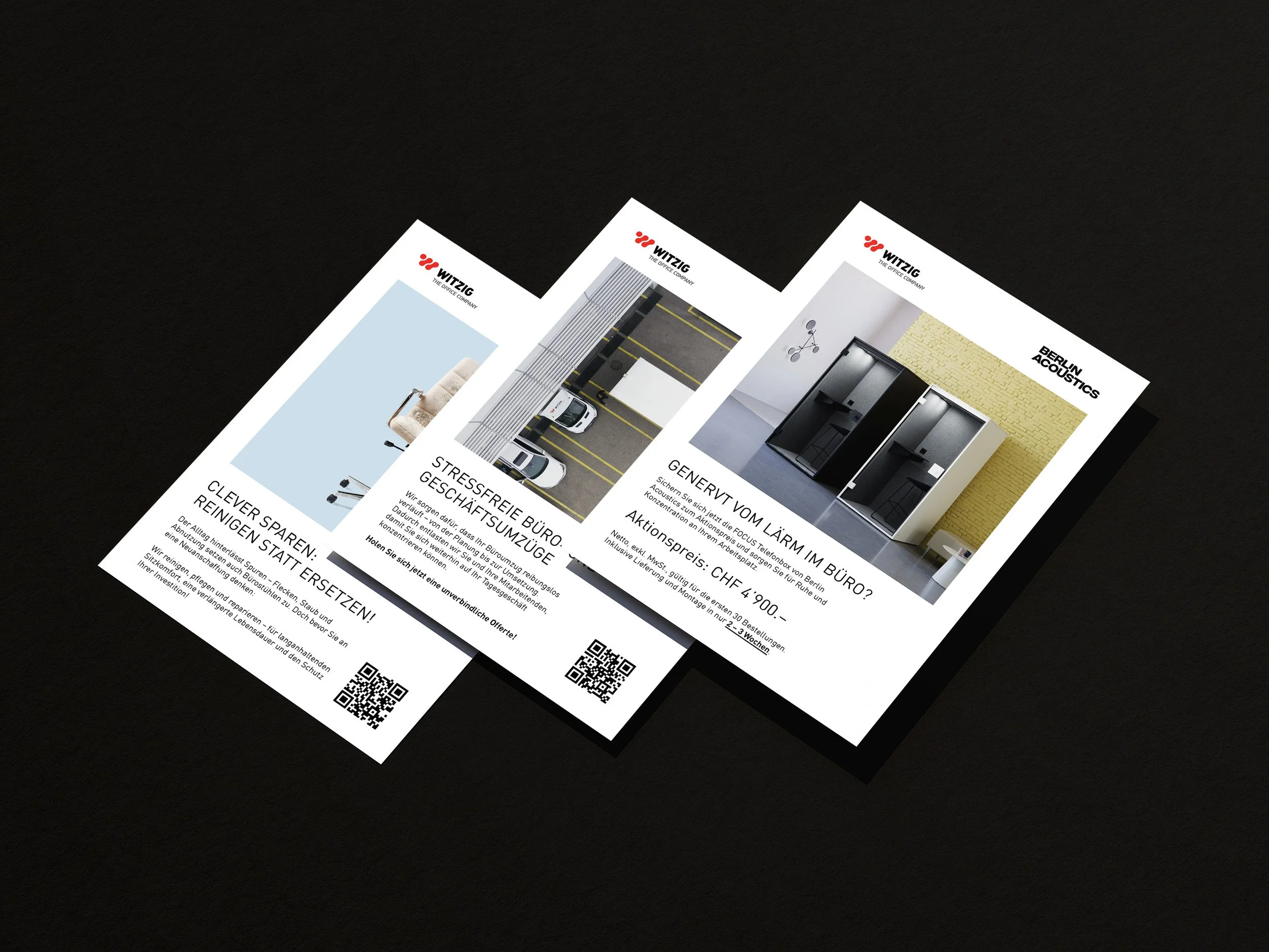 Drei Flyer für Büro- und Akustiklösungen liegen auf einem schwarzen Tisch. Die Flyer zeigen Bilder von modernen Innenräumen, Parkplätzen und Produkten der Firma Witzig.