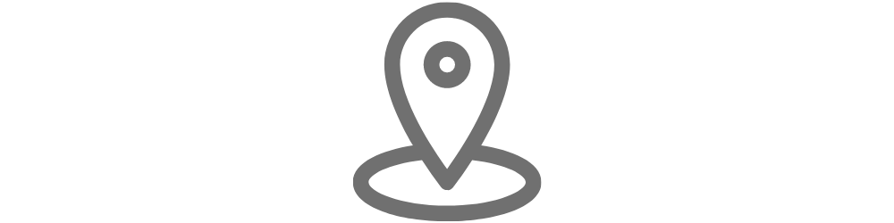 A grey location pin icon on a white background.
