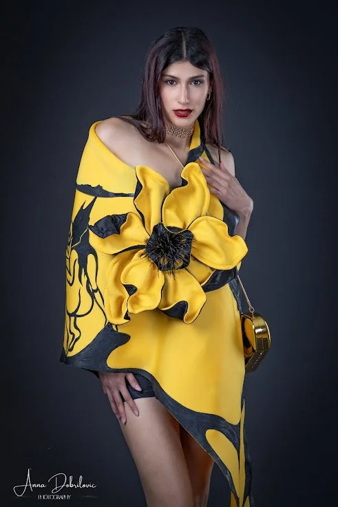 female in painted scarf with yellow and black flower