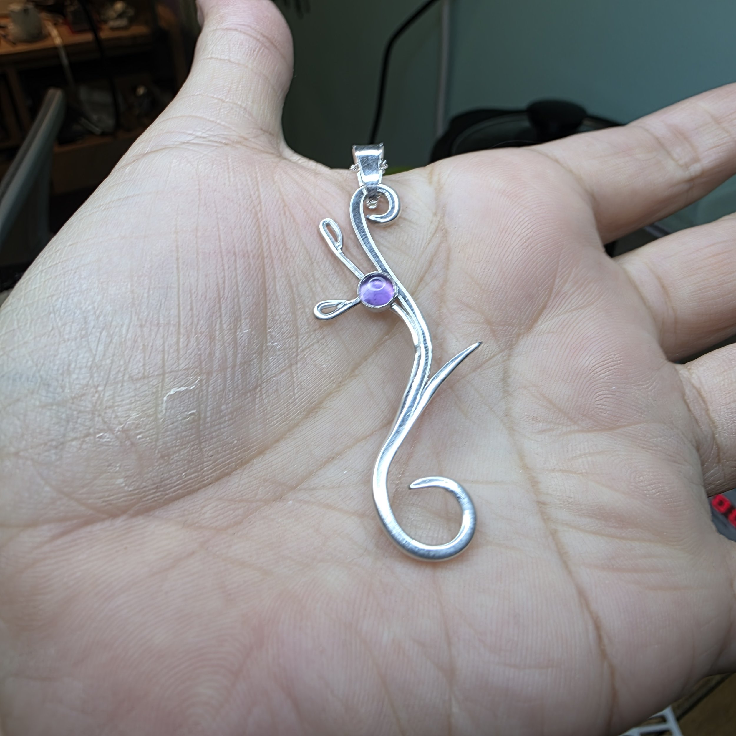 Heather contemp amethyst necklace  in hand.jpg