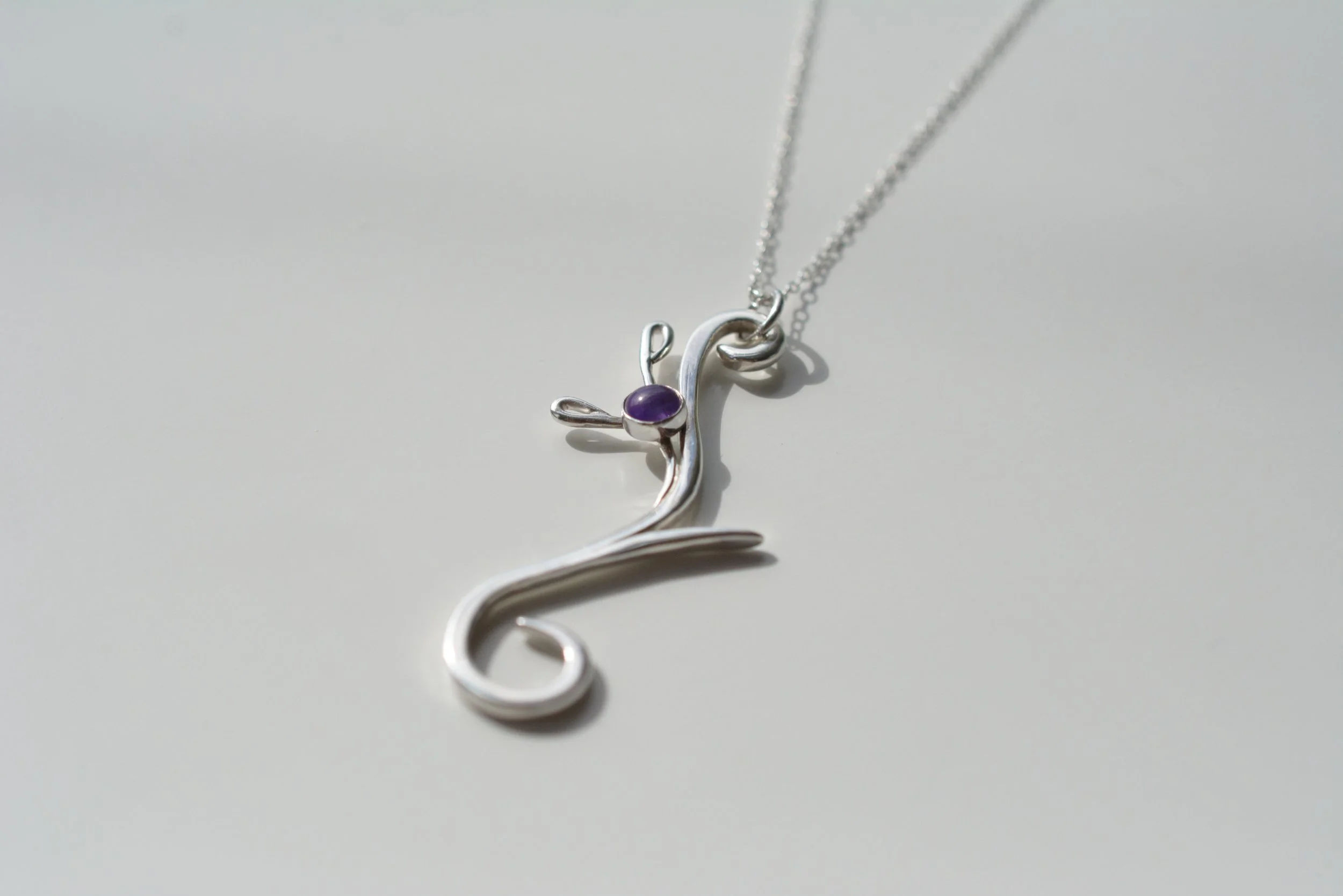 Heather contemp amethyst necklace  angled on white.JPG