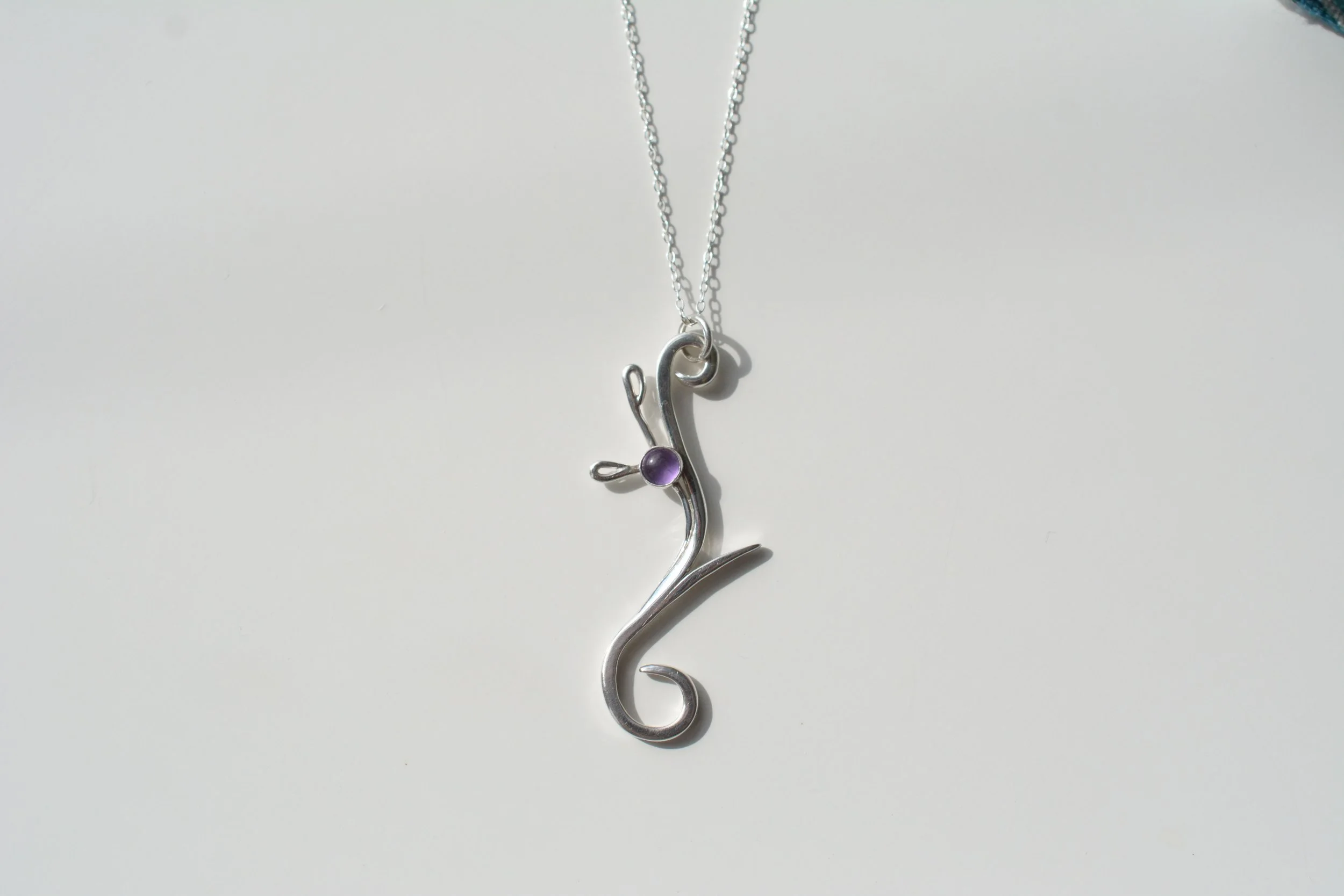 Heather contemp amethyst necklace white back.JPG