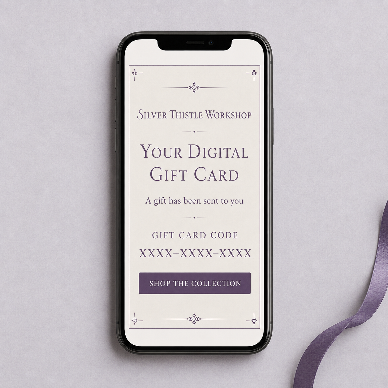 Digital Silver Thistle Workshop gift card displayed in an email on a mobile phone with a gift card code and shop link.