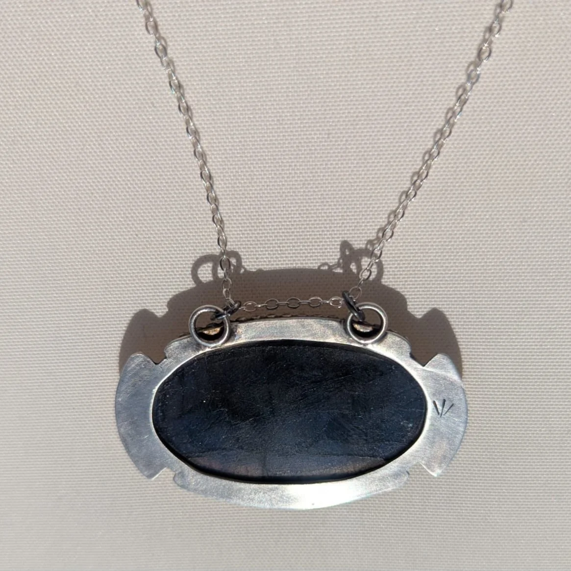 Large labradorite patina sun back white background.jpg
