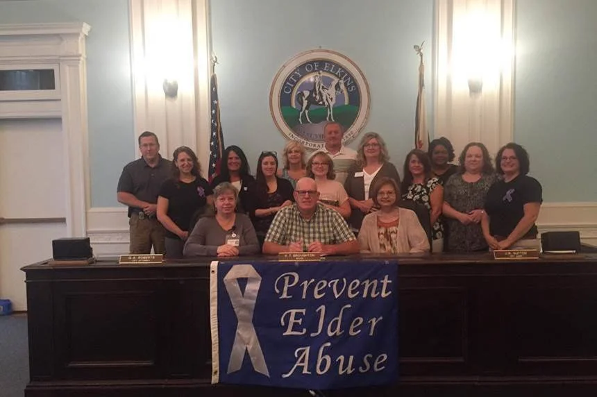  Members of the Community Connections for Vulnerable Adults and Seniors, Community Health Team, came together at Elkins City Hall for World Elder Abuse Awareness Day.      Click image to read more