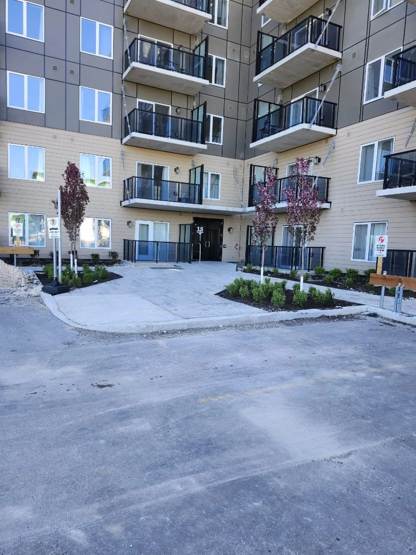 Commercial landscaping project for a Winnipeg multi-family development by Stellar Landscapes featuring low-maintenance plantings and professional property curb appeal.