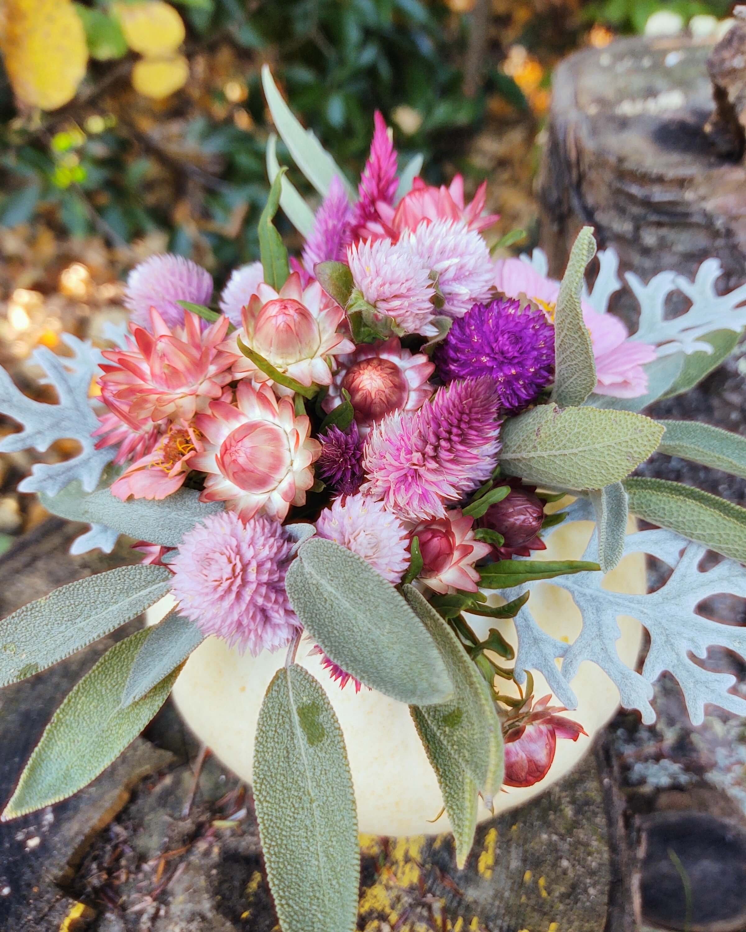 Pink flowers in white pumpkin
