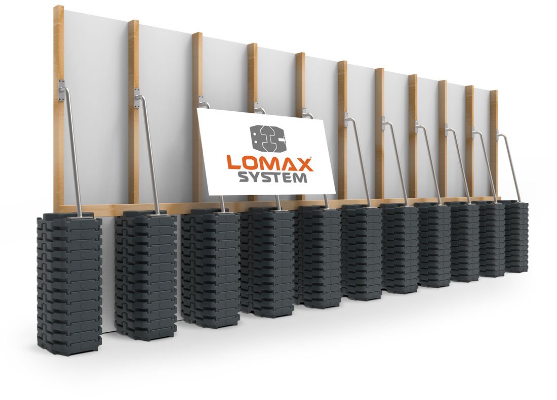 A set of portable office privacy panels with stacking bases and a logo sign that says "LOMAX SYSTEM."
