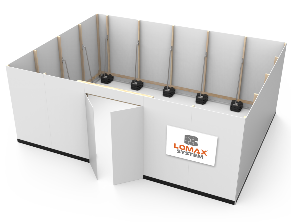 A white modular wall system with black weight stacks and lifting bars, labeled 'LOMAX SYSTEM' in orange and black, designed for strength training or physical therapy.