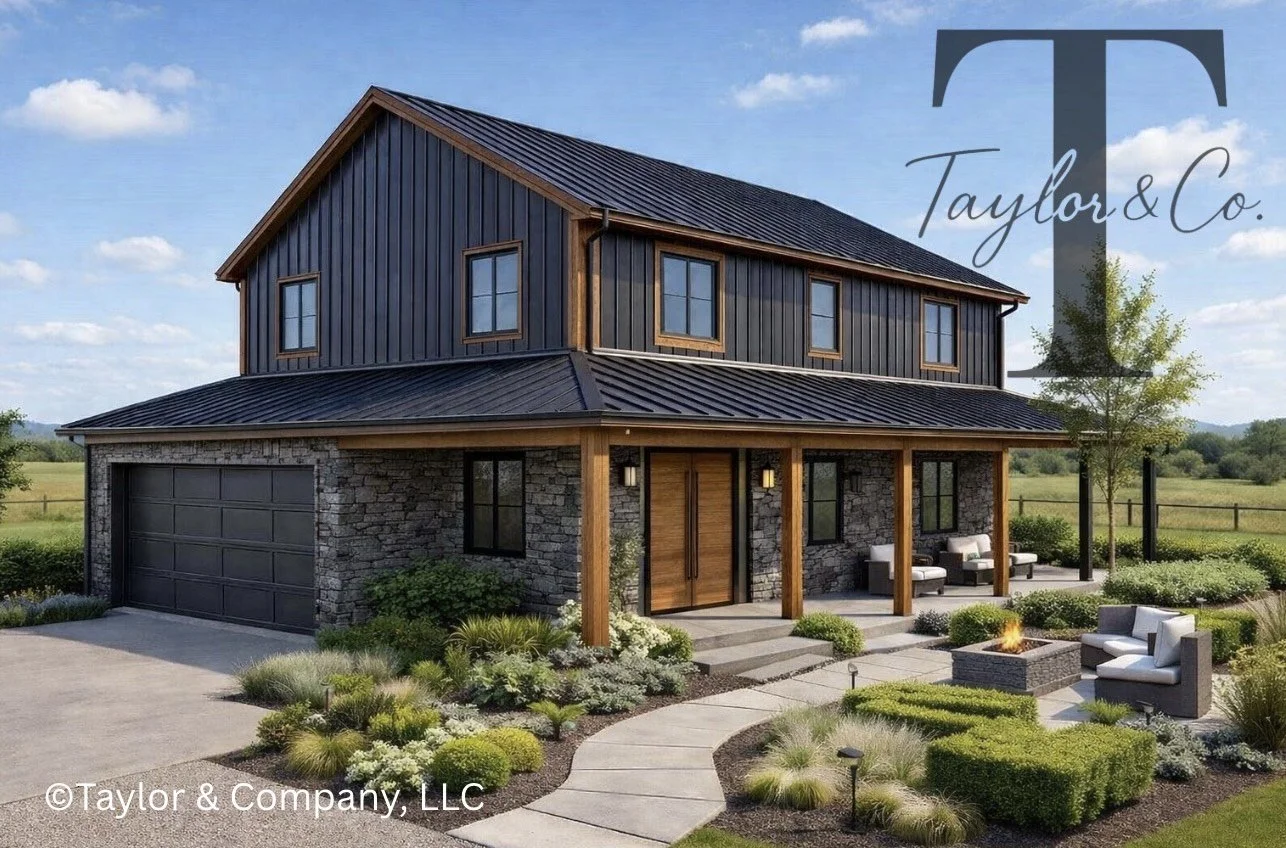 A modern two-story house with a stone and metal exterior, black garage door, and a front porch with seating. The front yard has landscaped plants, a pathway, and an outdoor firepit with chairs, set in a rural area with open fields and blue sky.