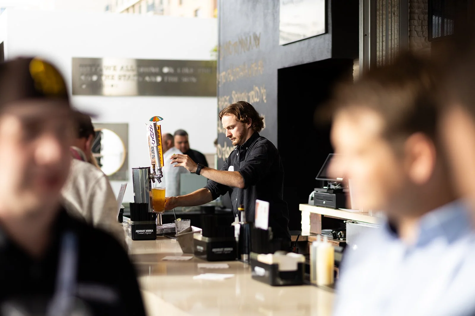 San Diego Convention happy hour. Bar tender pours a beer.