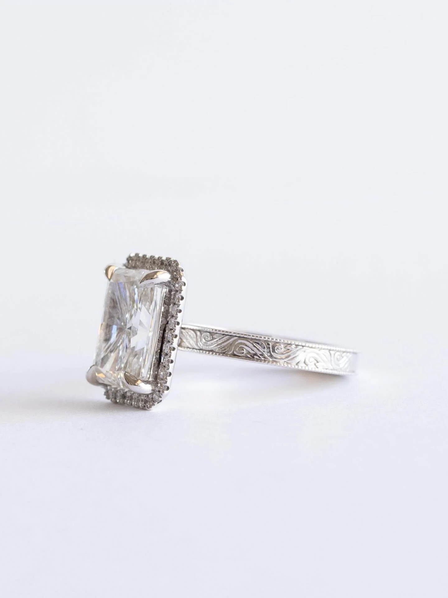 *Alexa, play 90s country hits* ✨

4 carat &bull; halo &bull; vintage engraved detailing 

[vintage diamond engagement ring, engraved band, engraved diamond ring, radiant diamond, radiant engagement ring]