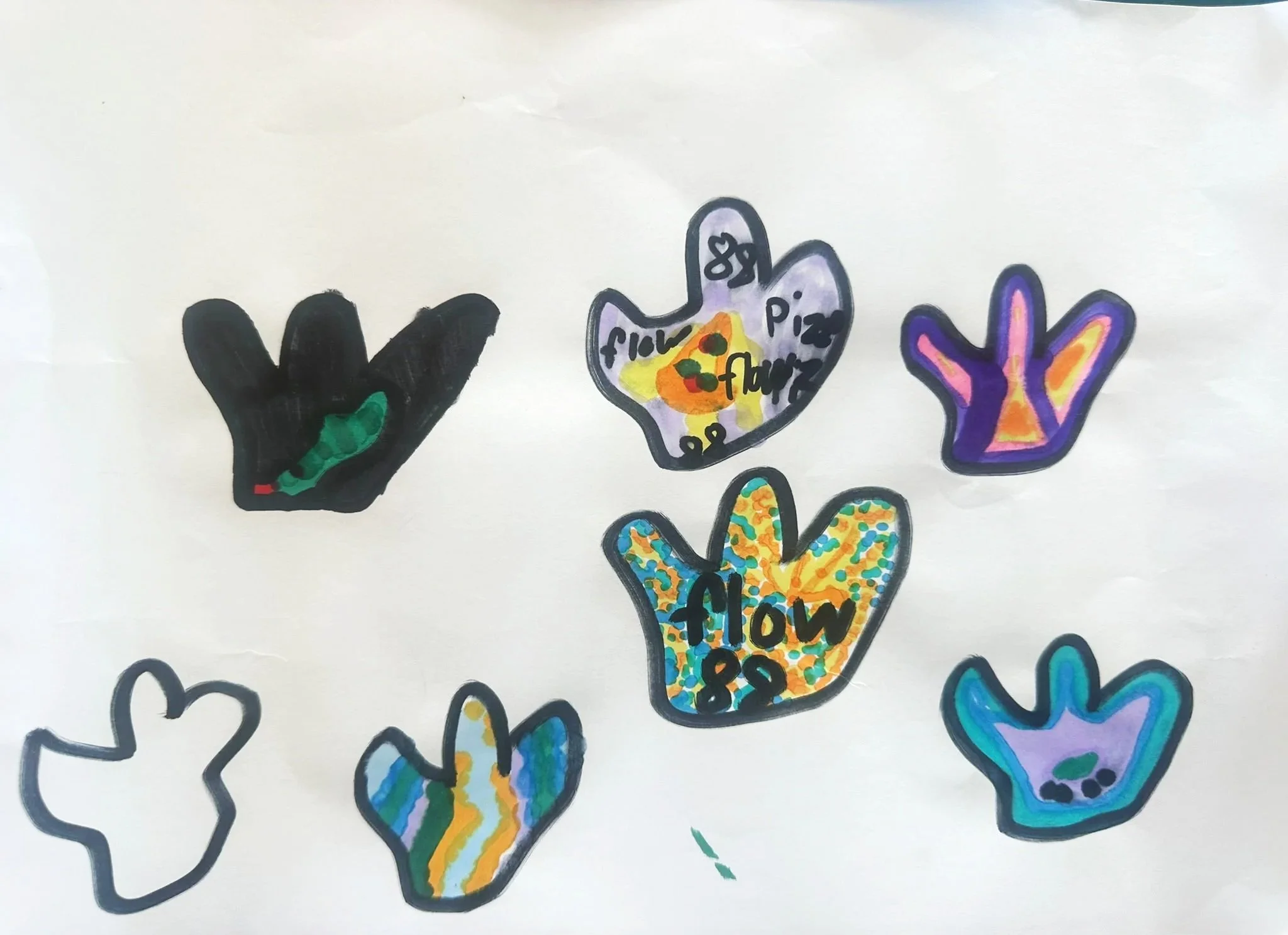 Collection of colorful hand-drawn hands, each with different designs, patterns, and words like "flow" and "peace".