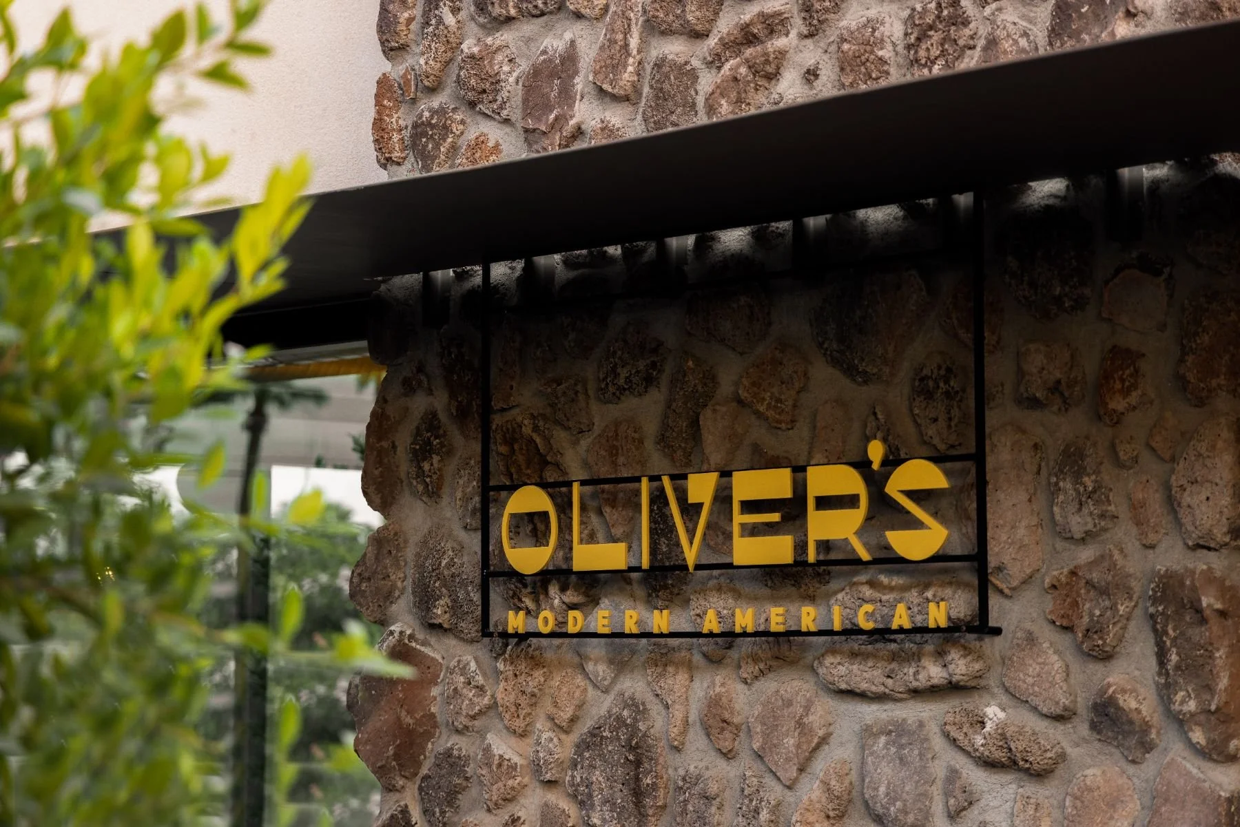 olivers-modern-american-restaurant-exterior-logo-sign-stone-wall.jpeg