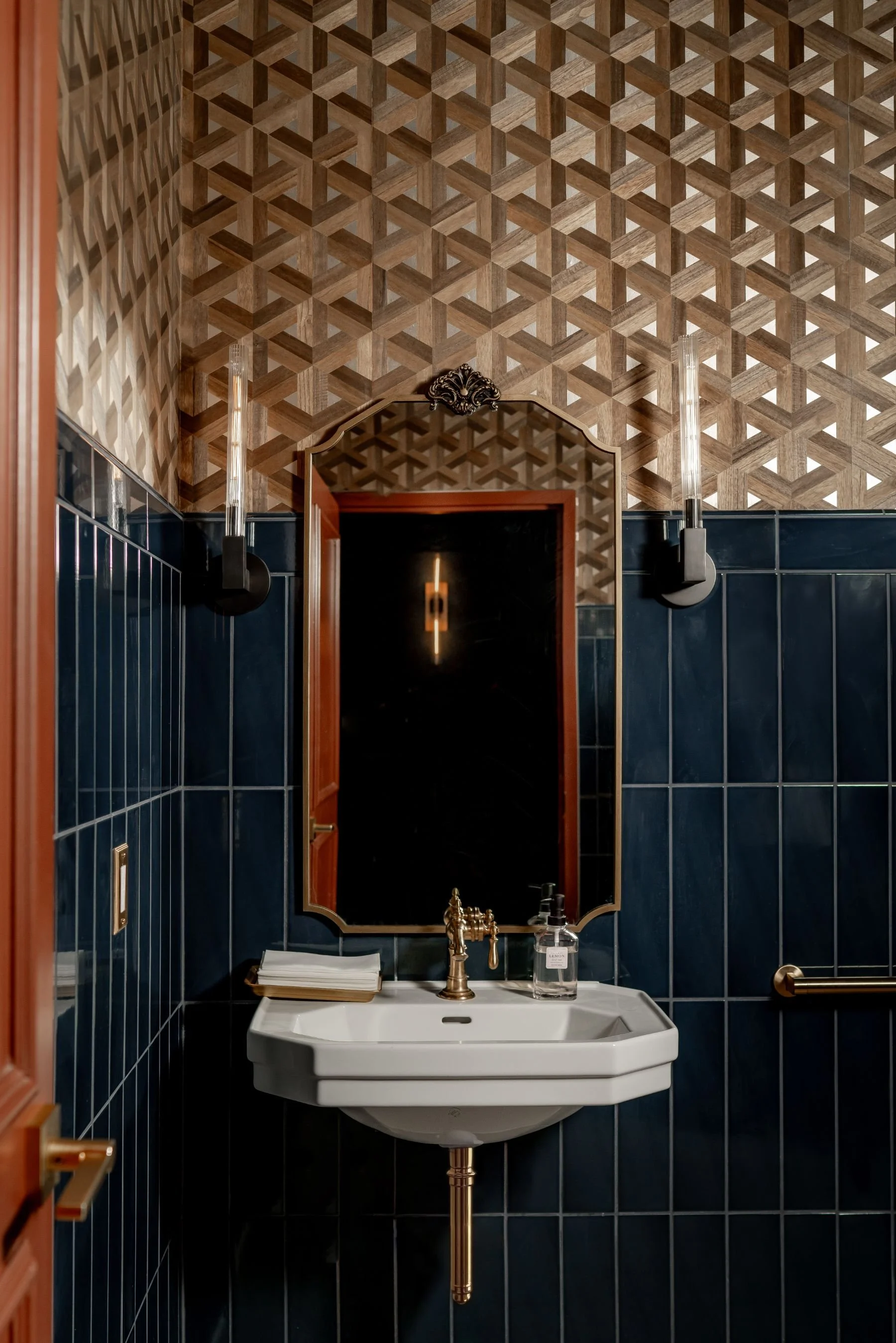barley-and-smoke-restaurant-bathroom-dark-tile-design.jpeg