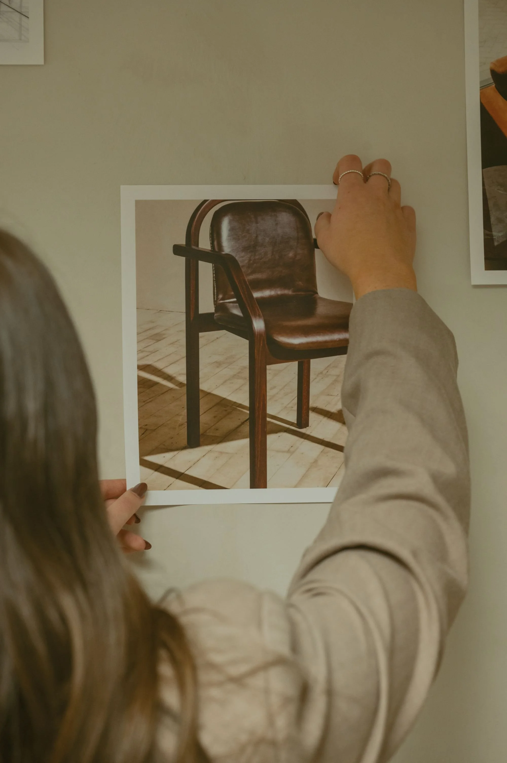 Interior designer presenting a hand-drawn chair sketch during a client design consultation