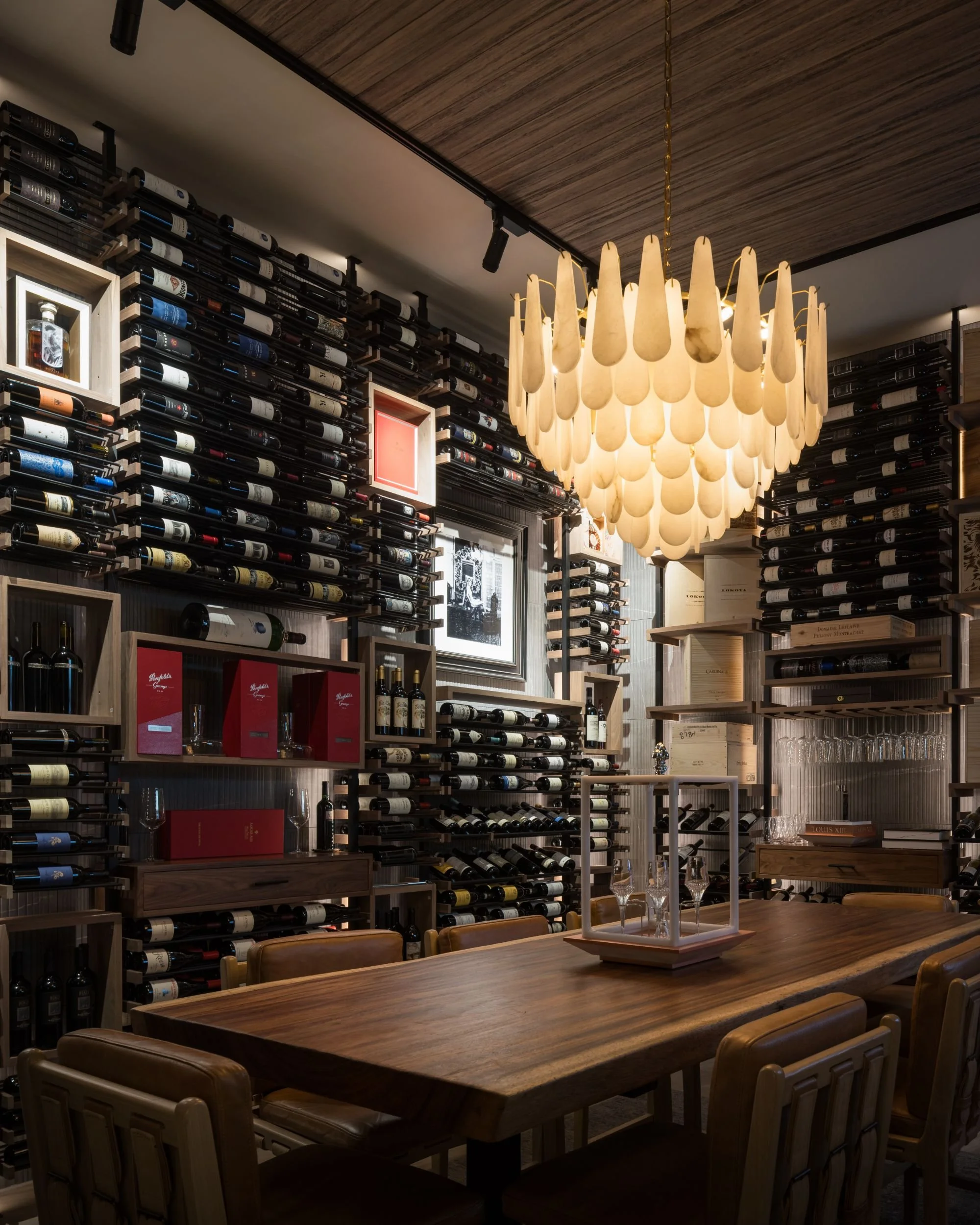 the-guest-house-las-vegas-wine-wall-amber-chandelier-design.jpeg