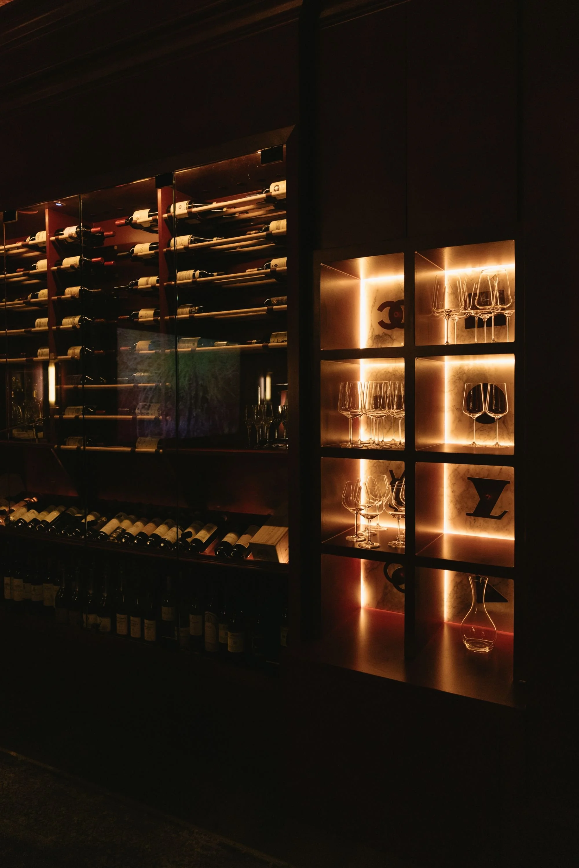 the-guest-house-austin-pdr-wine-wall-dark-interior.jpeg