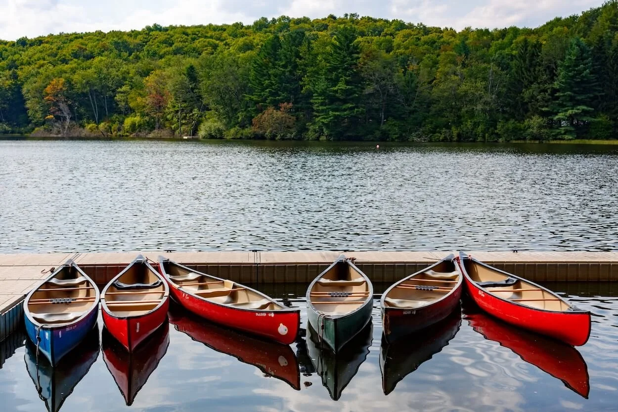 Canoes on a body of water in the Hudson Valley.