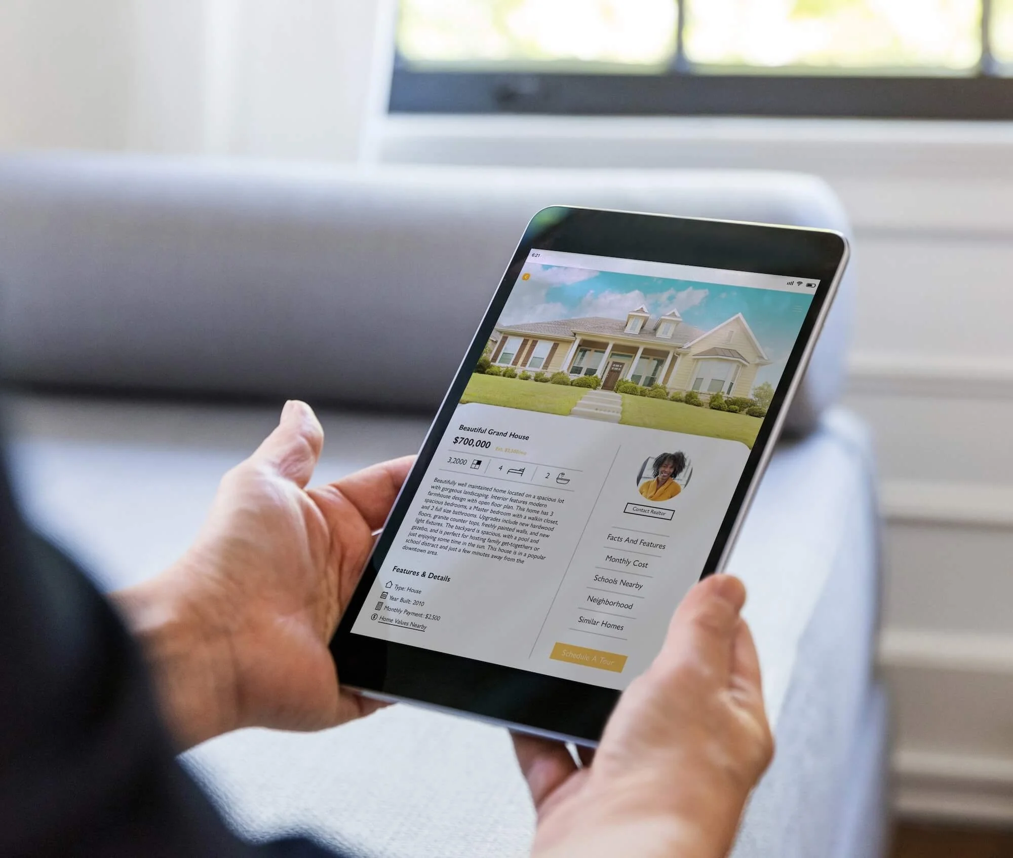 Person looking at a home search site on a tablet.