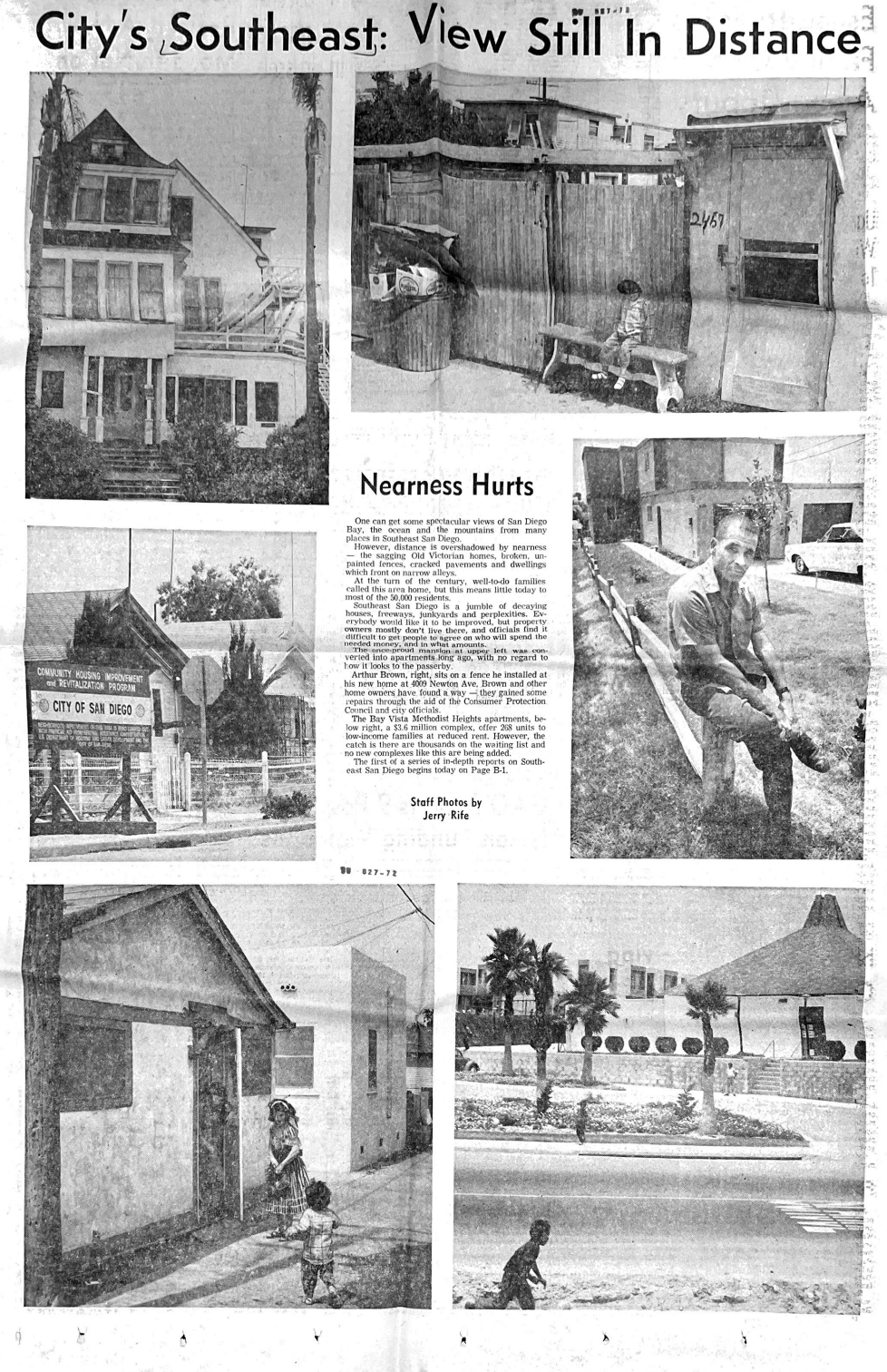 A black and white newspaper article titled 'City's Southeast: View Still In Distance' features six photographs showing various scenes of southeast San Diego. The images include a damaged Victorian house, a fenced backyard with a child sitting on a bench, a sign for a community housing improvement project, children playing outside a house, some palm trees in front of a modern building, and a woman sitting on a bench. The text discusses neighborhood decline and redevelopment efforts.