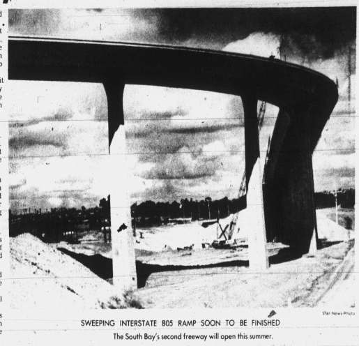 Black and white photograph of a new highway ramp under construction labeled 'Sweeping Interstate 805 Ramp Soon to be Finished,' with a caption noting it will open this summer.