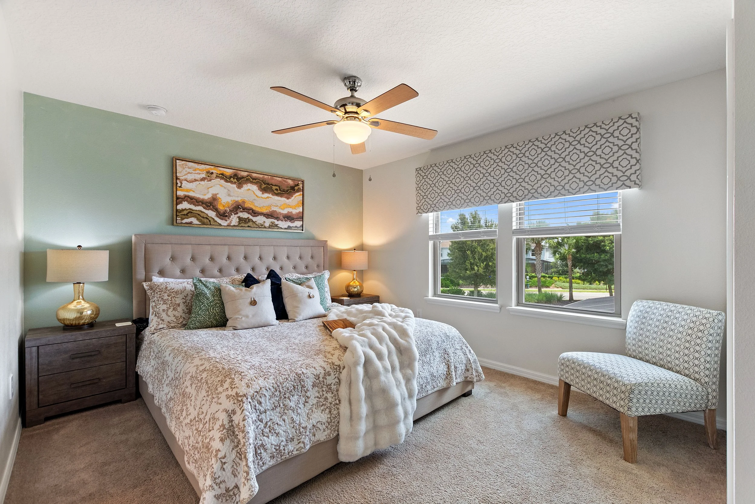 Second floor primary king suite at Anchor Cove Villa — luxury bedroom with king bed and big screen TV, Solterra Resort vacation rental Davenport FL.