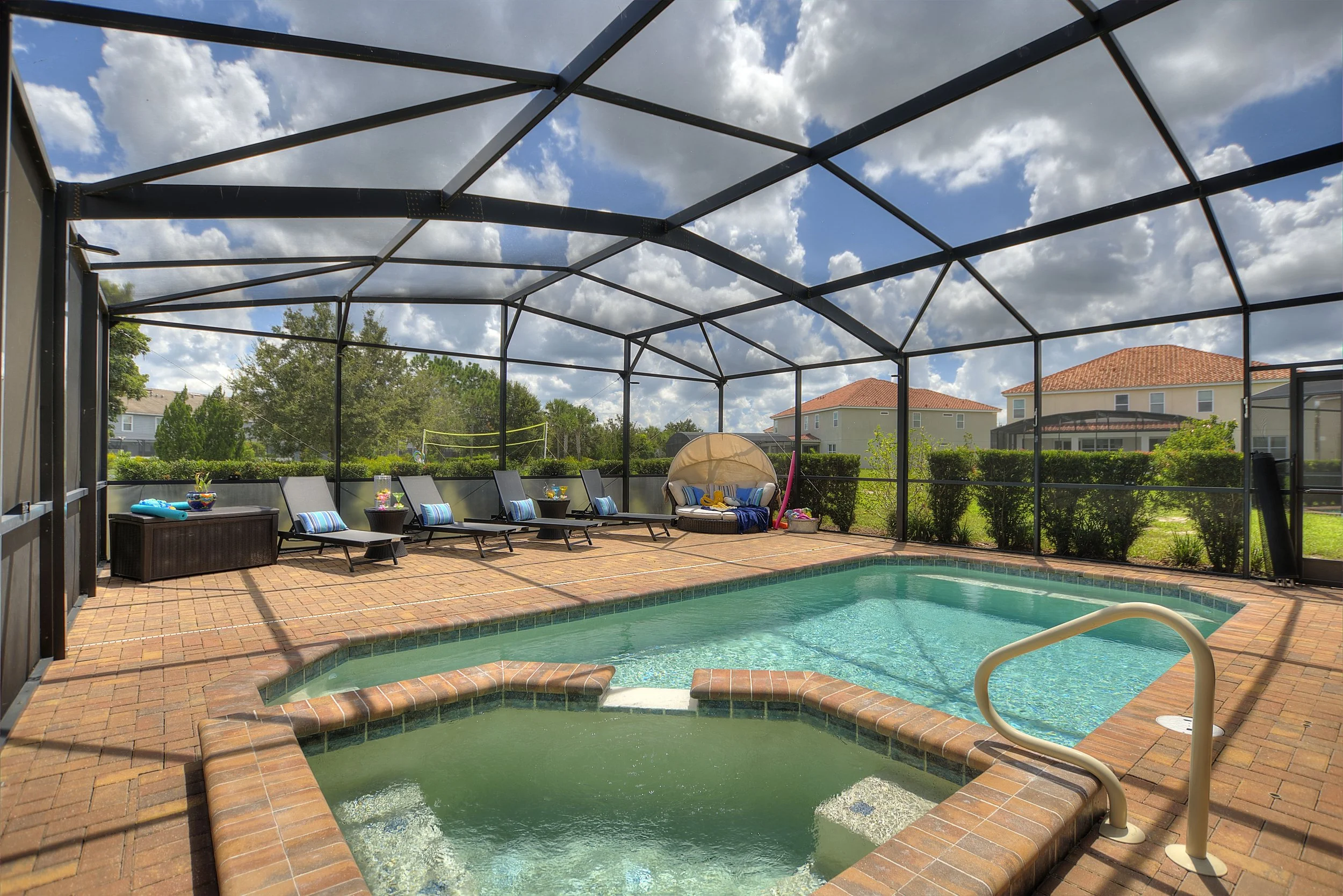 Private screened-in heated pool and sun loungers at Anchor Cove Villa — luxury vacation rental with private pool at Solterra Resort, Davenport FL near Disney World.