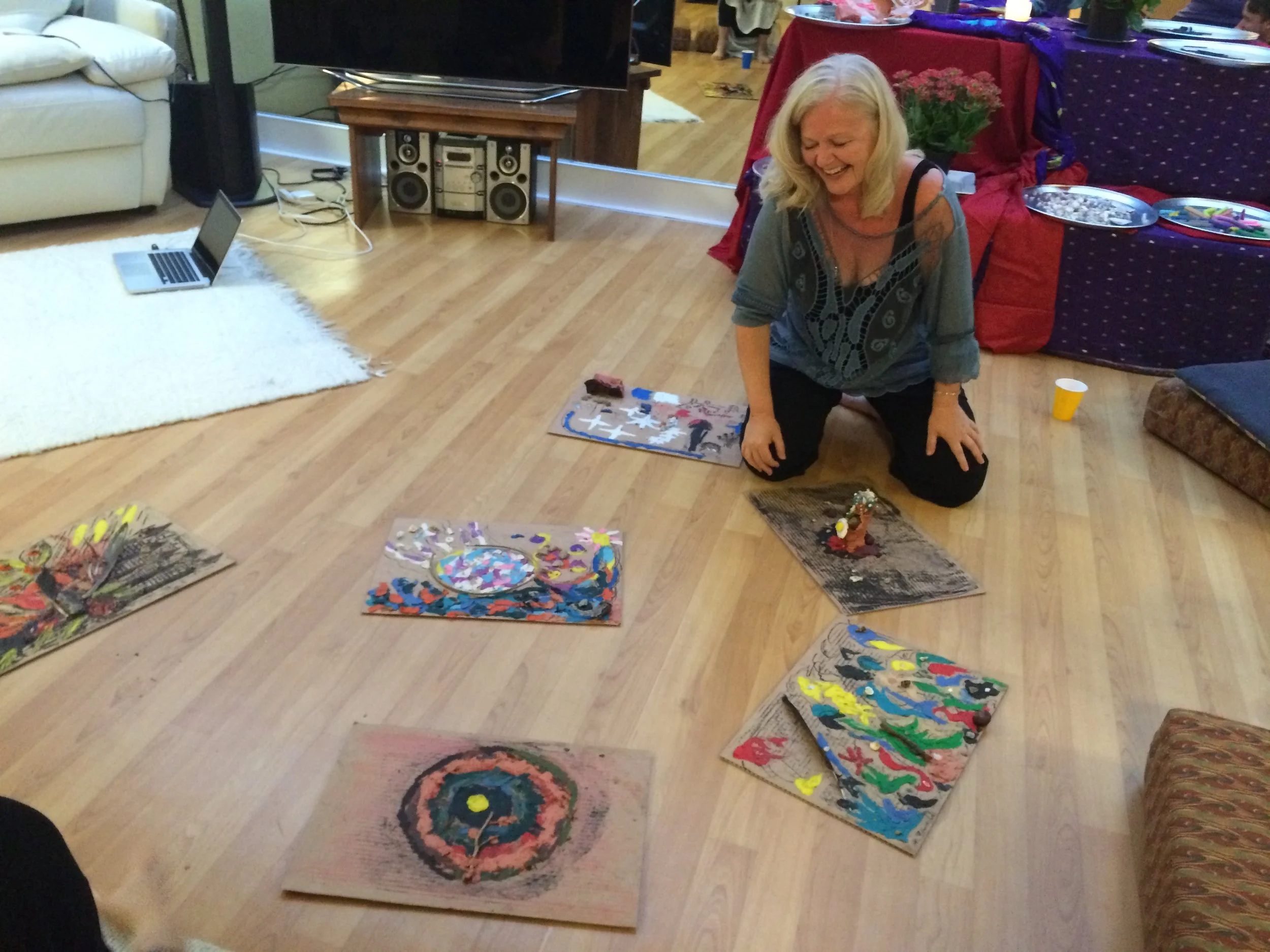 woman enjoying creations of mandalas in plasticine in an expressive arts class