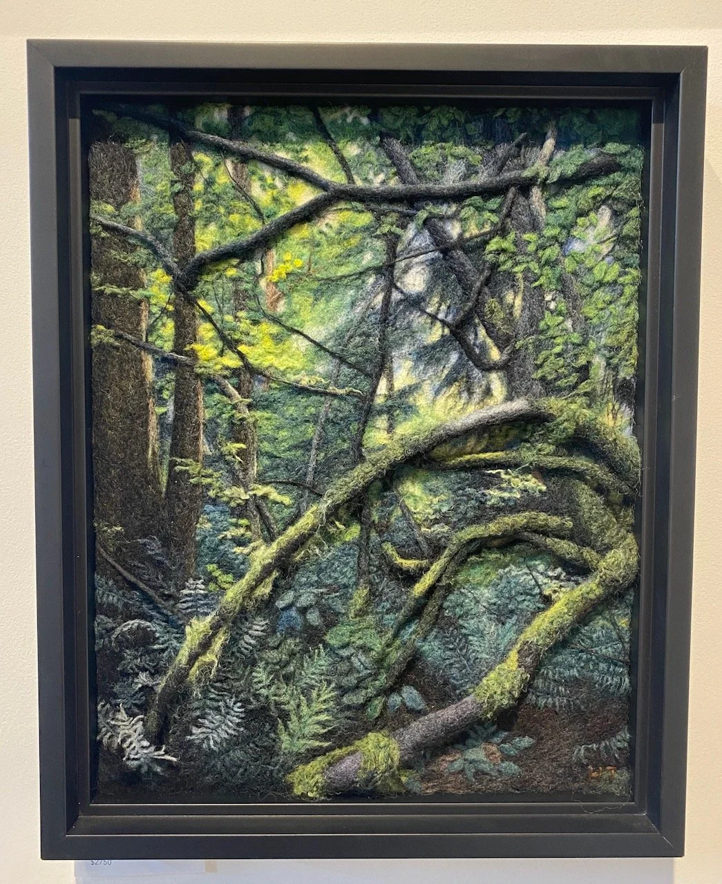 A detailed painting or photograph of a lush forest scene with moss-covered tree trunks and twisted branches, with green leaves and ferns on the forest floor.