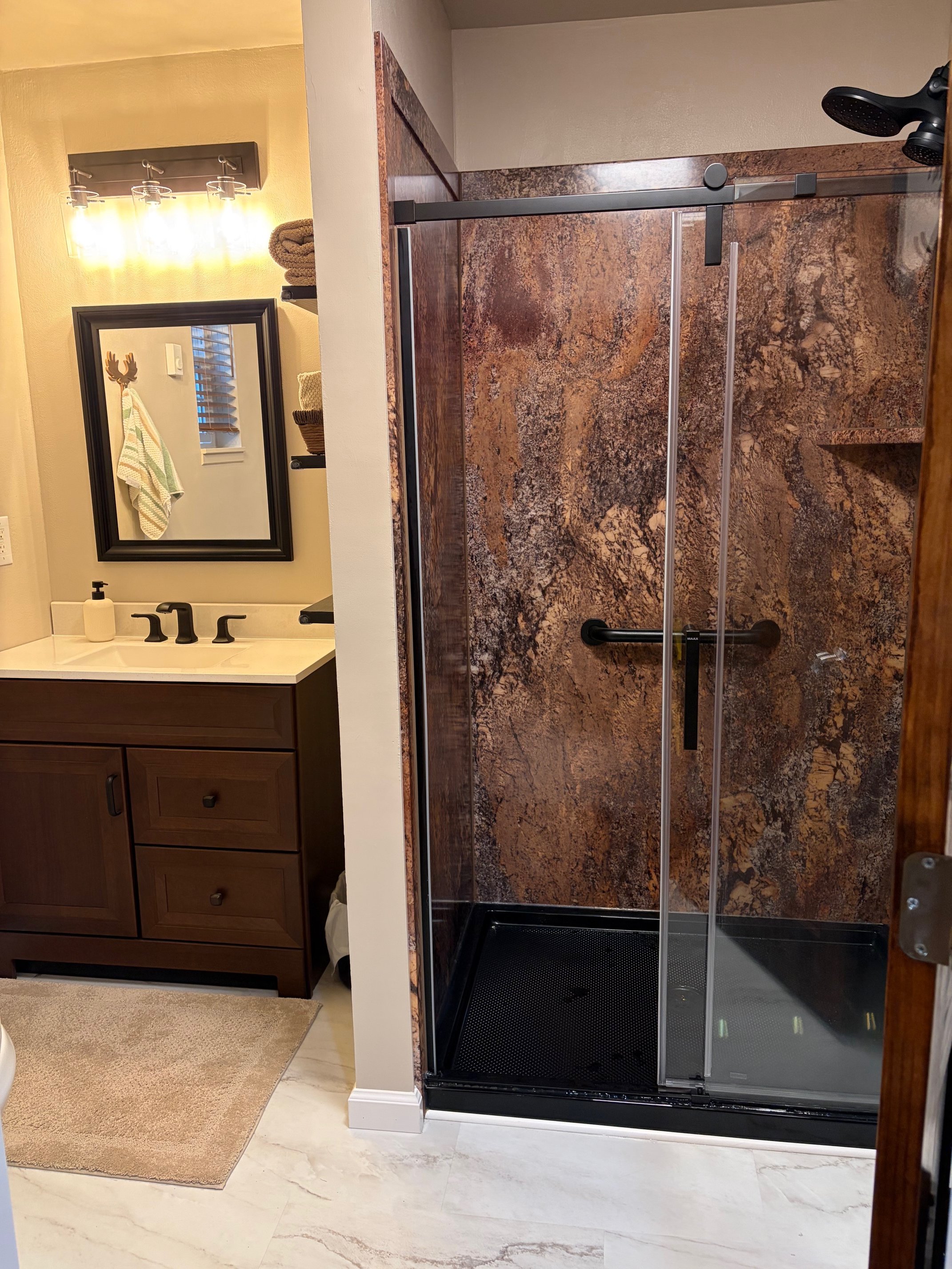 Bathroom refresh, new flex stone shower, new vanity, new toilet, new LVT flooring, new texture, new baseboards, new paint, and new exhaust fan/light upgrade.