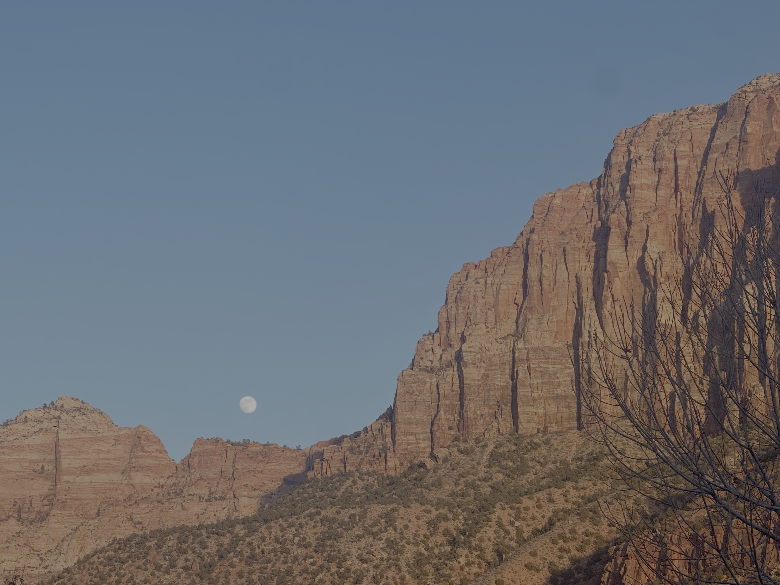Southern Utah desert landscape with layered red rock cliffs, reflecting the natural environment that inspires Strata’s chef-driven dining concept.