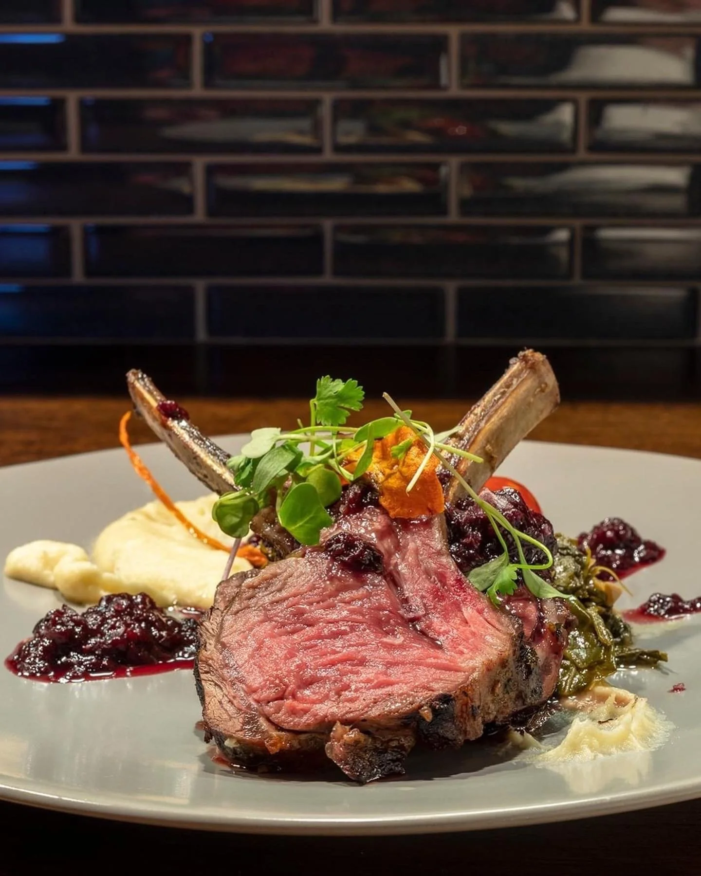 Chef-prepared lamb with seasonal accompaniments, showcasing Strata’s refined, ingredient-driven approach to modern dining.