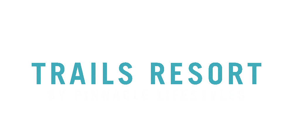 Logo of Trails Resort by Pinnacle Lifestyles featuring a mountain and trail design.