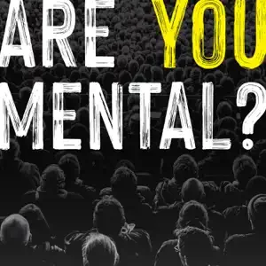 Audience at a mental health conference with the question 'Are You Mental?' displayed.