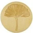 Gold-colored coin featuring a stylized tree or fan design with radiating lines