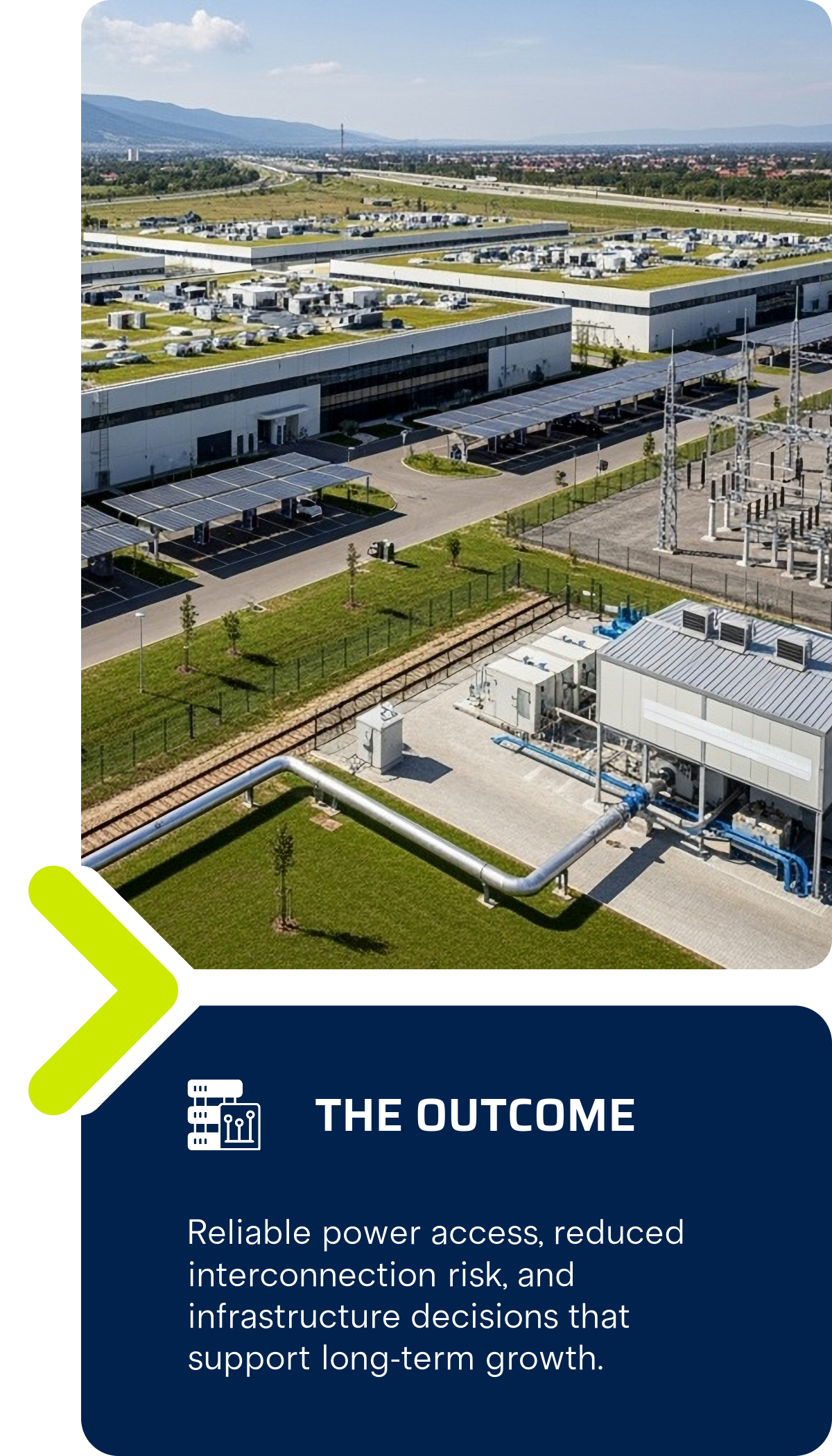 Aerial view of a modern data center with multiple buildings, solar panels, and extensive power infrastructure surrounded by green grass and trees.