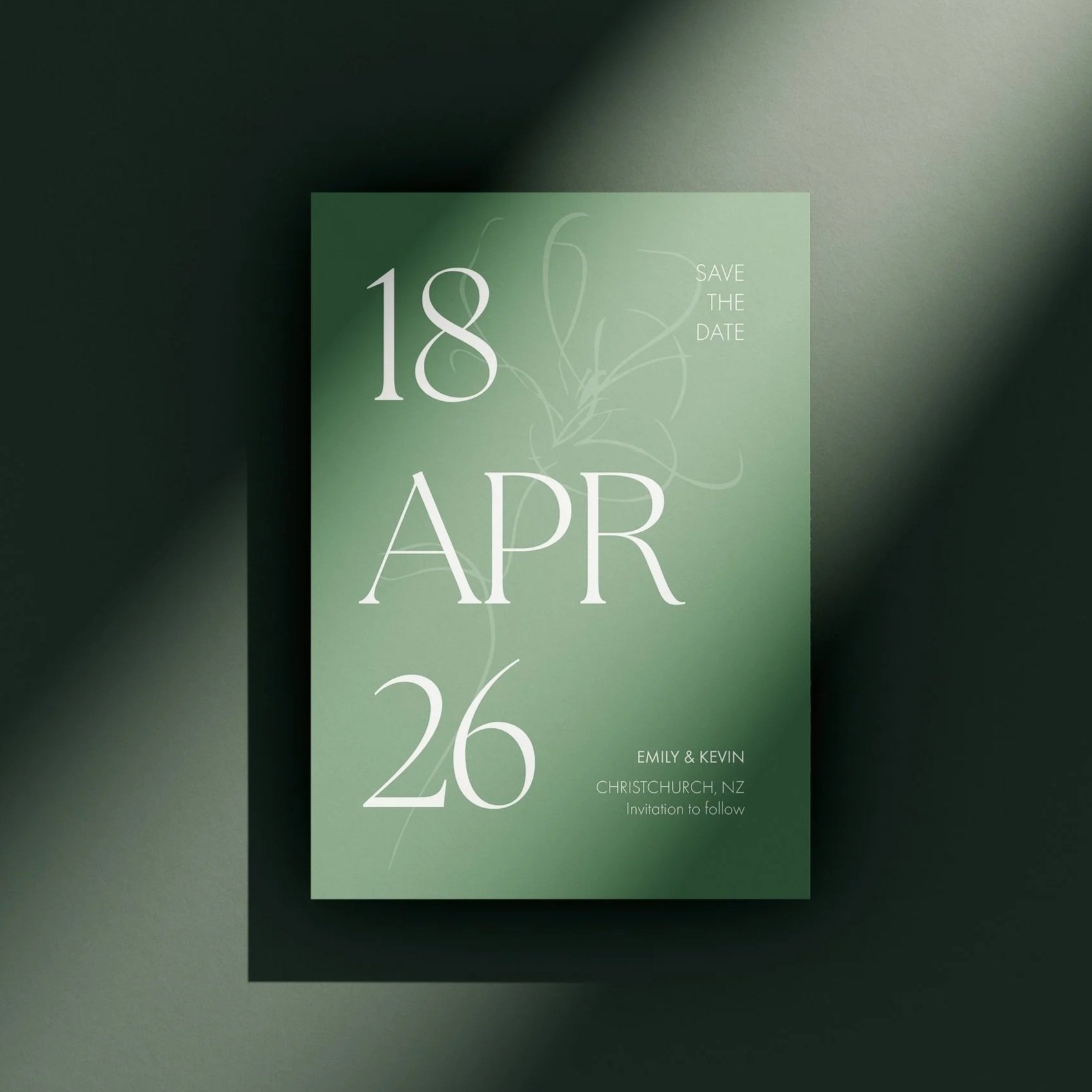 Green Save the Date wedding invitation with white text displaying the date April 26, 2018, and names Emily and Kevin from Christchurch, New Zealand.
