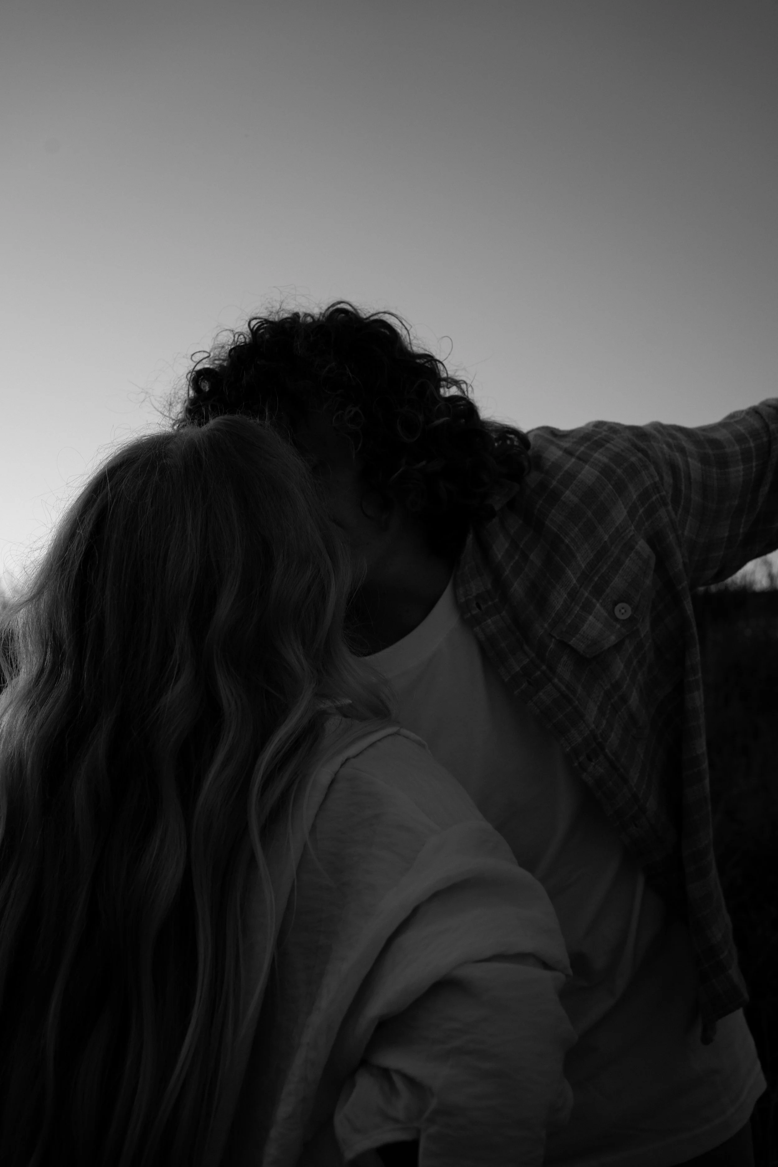 An intimate black-and-white moment in Rainbow, TX, capturing closeness and quiet emotion between the couple.