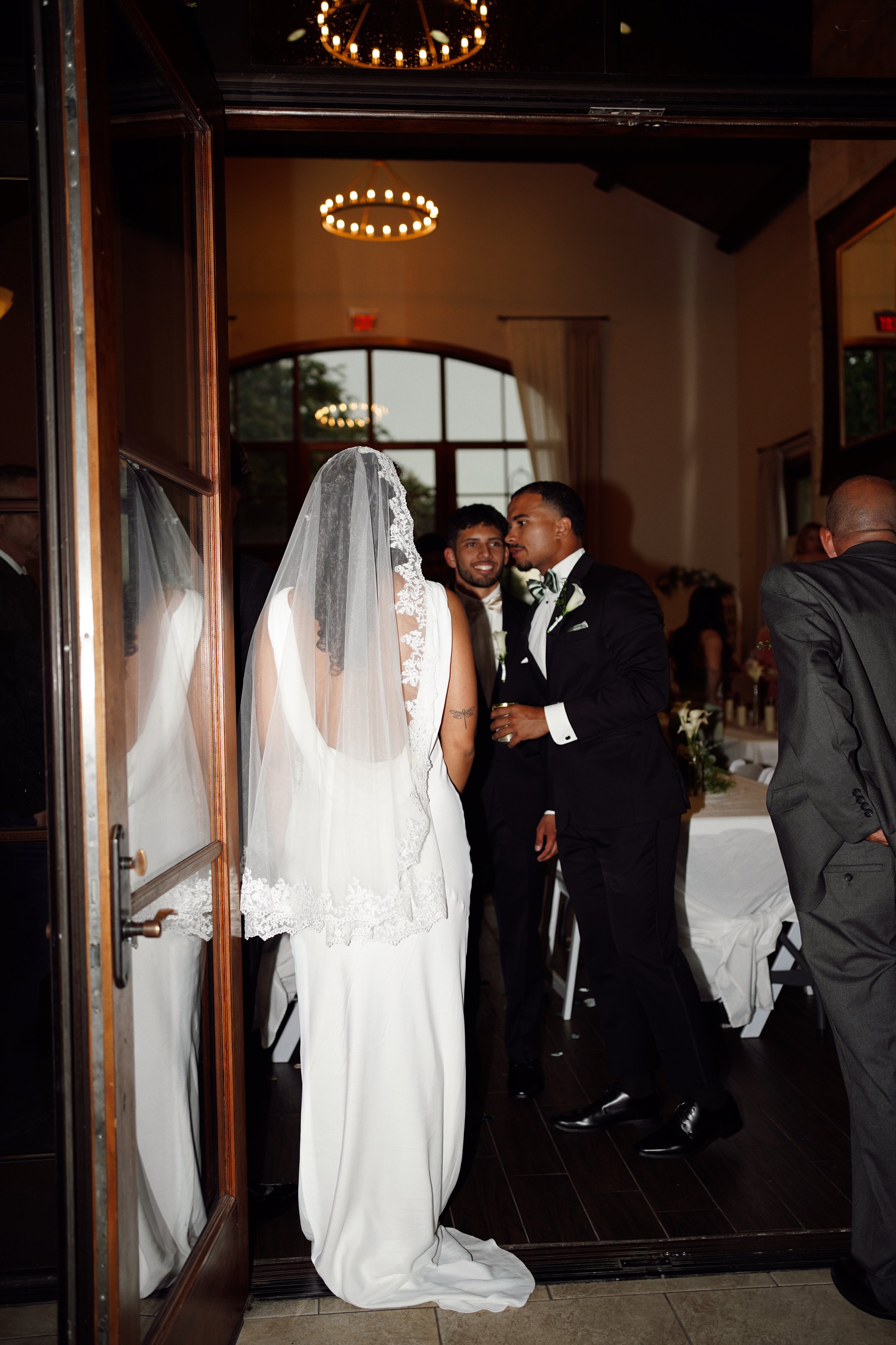 The couple enters their reception in Richmond, TX, capturing excitement and celebration as the evening begins.
